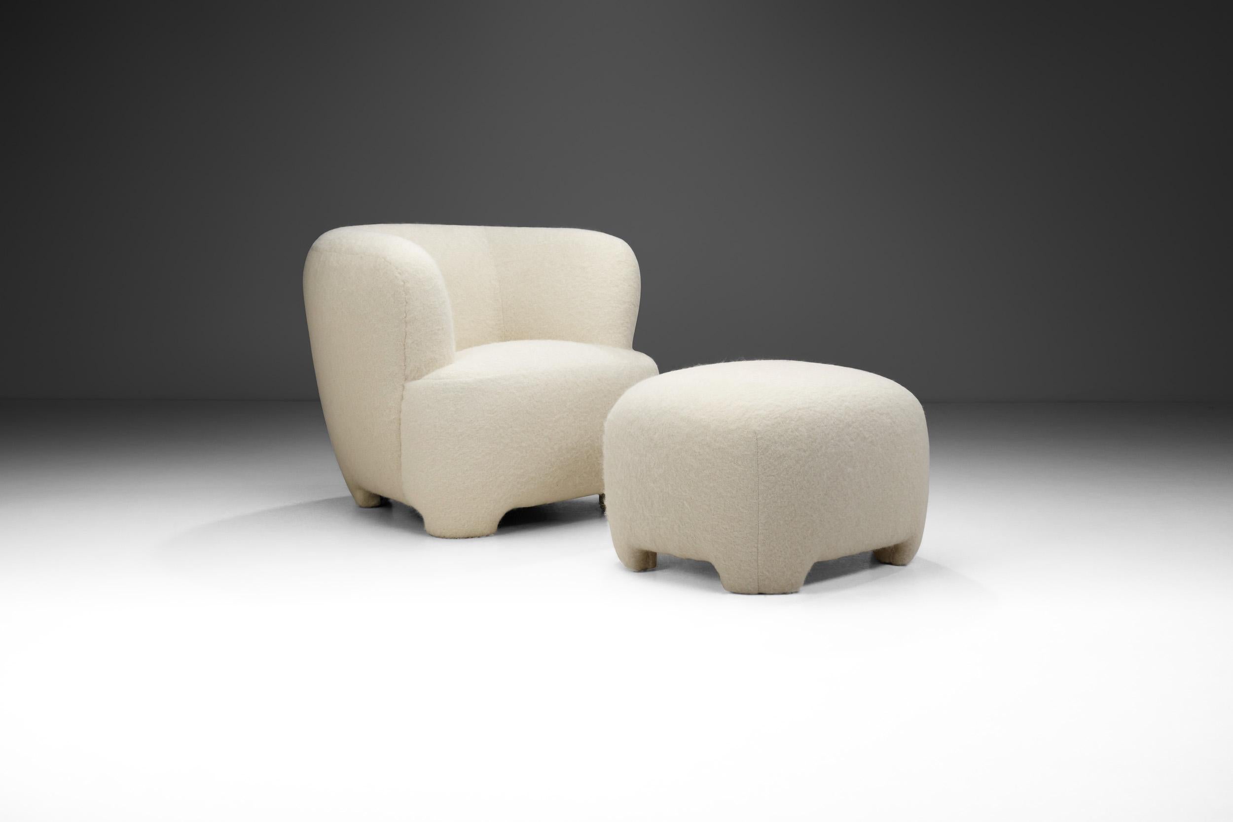 This pair of lounge chair and ottoman is an elegant and comfortable evidence of the mastery and artistry of the European cabinetmakers who defined mid-20th century modern seating. This duo is of the highest quality, both in terms of visual quality,