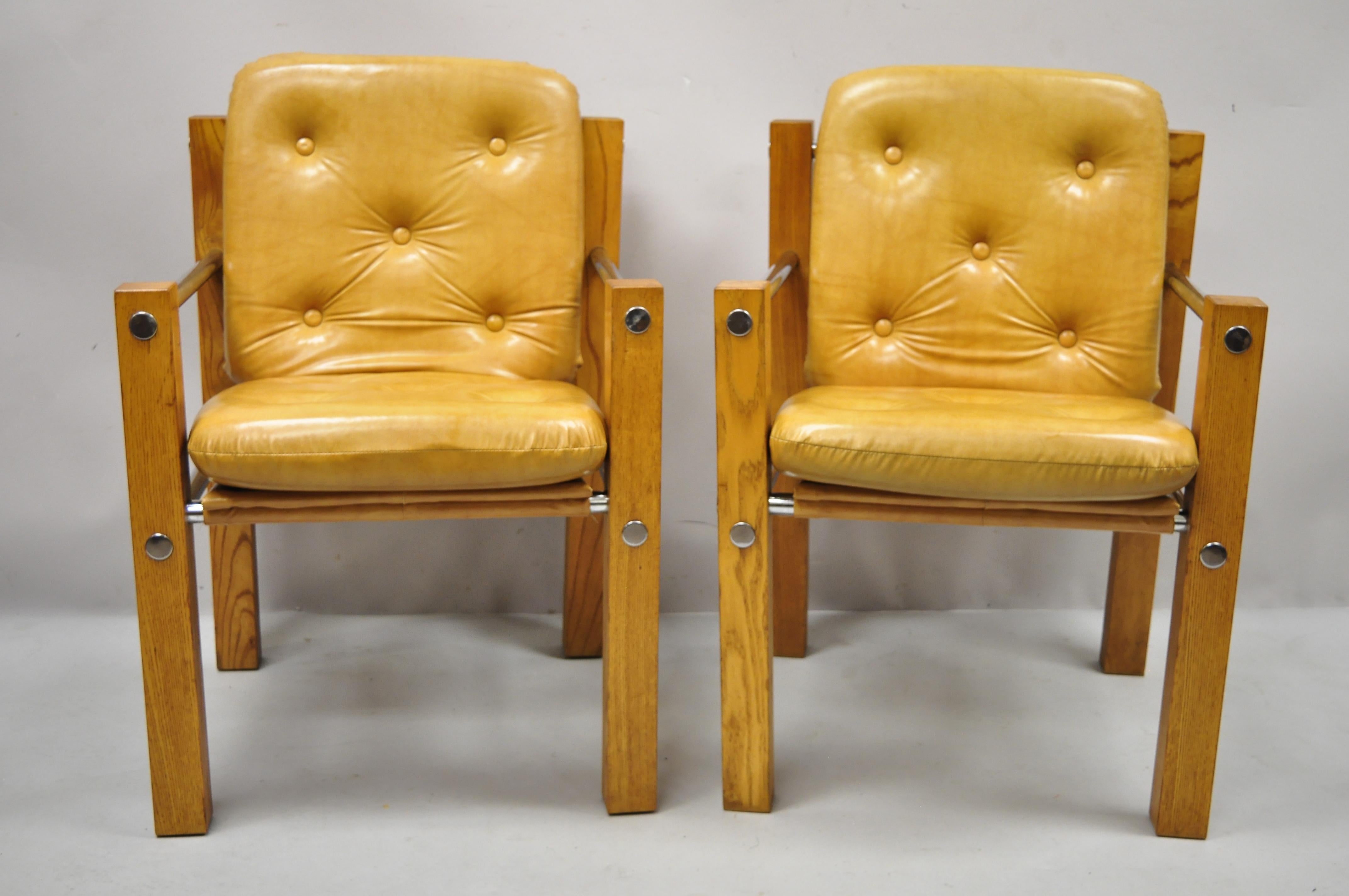 Vintage Mid-Century Modern Cal style Inc. oak chrome sling lounge chairs, a pair. Item features chrome stretchers, vinyl slings, brown naugahyde cushions, solid oak wood frame, very nice vintage pair, clean modernist lines, great style and form.