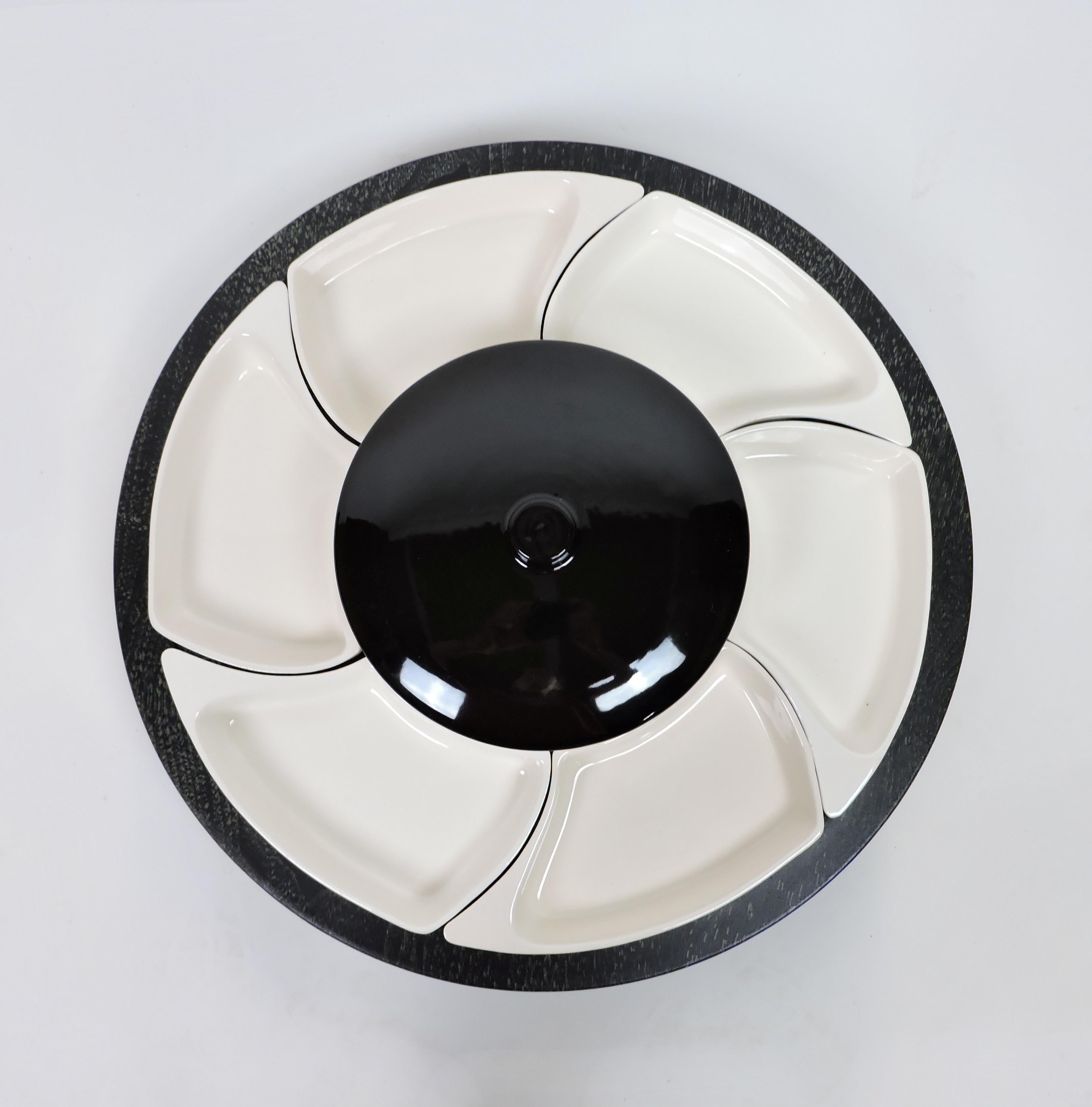 Beautiful and large lazy Susan serving tray by Santa Anita Ware of California. This serving platter has 6 individual side dishes that surround a center bowl with a lid in a striking black and white design that will never go out of style. For added