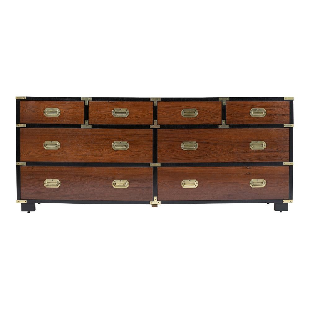 This circa 1960s midcentury Campaign rosewood chest has been completed restored and is in great condition. This piece features a new black and rosewood color combination with a lacquered finish, four small drawers, and four large drawers each come