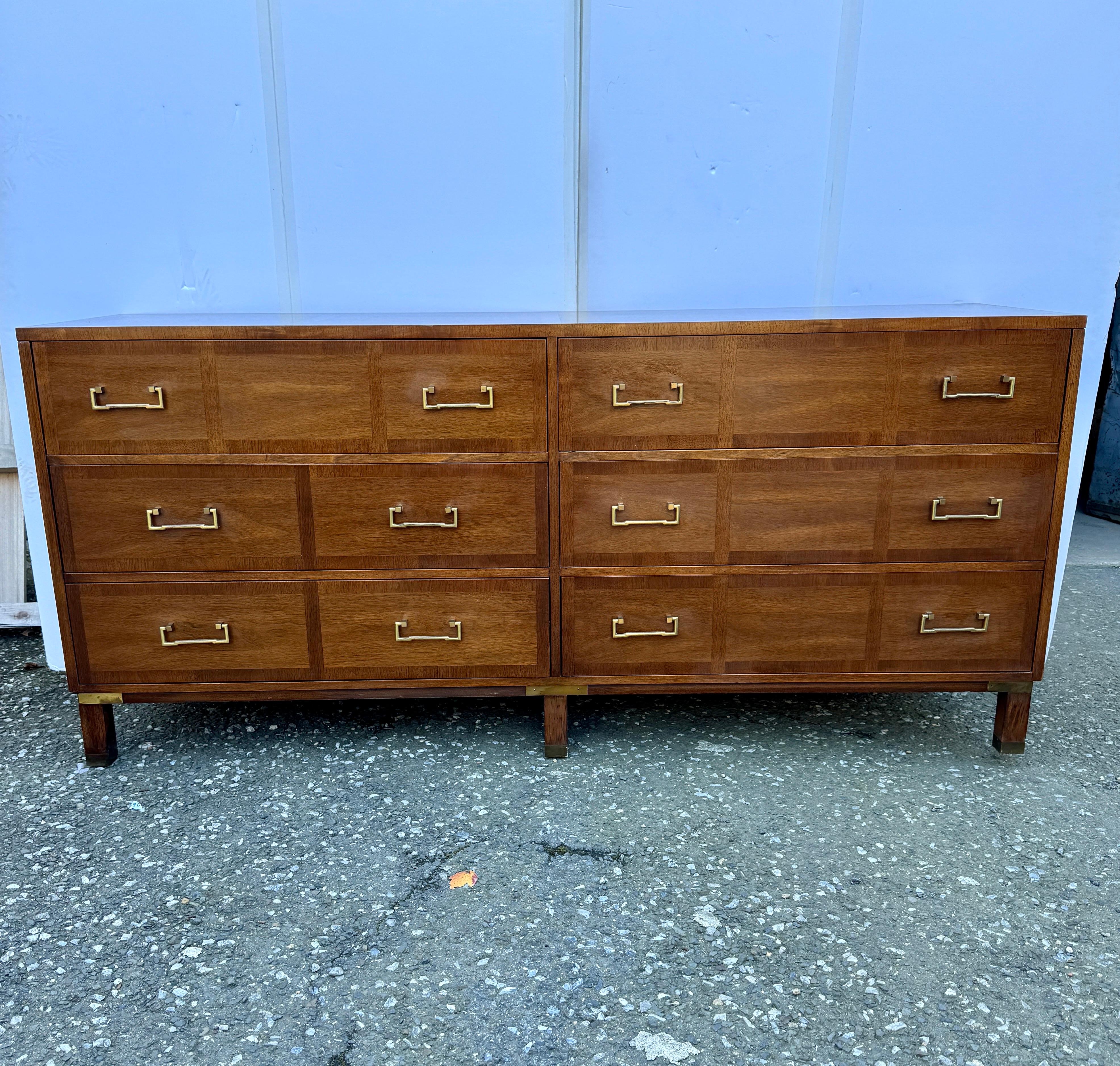 Sligh Furniture Six Drawer Mid Century Modern Chest by Sligh Furniture

Experience the timeless sophistication of the Campaign Style six dresser by Sligh Furniture Co., crafted circa 1950s. This vintage walnut with solid brass hardware and accents,
