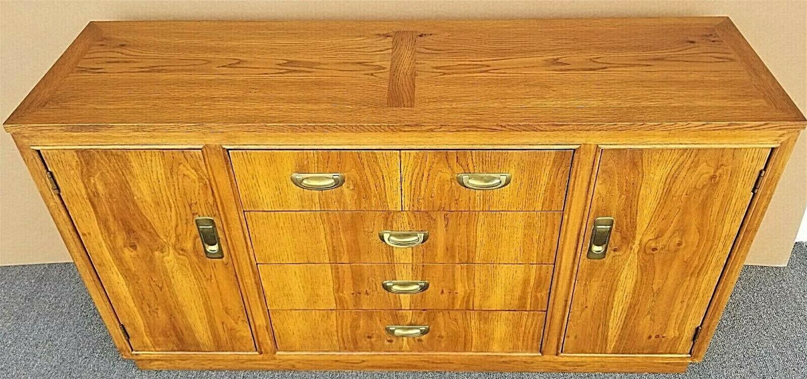Offering One Of Our Recent Palm Beach Estate Fine Furniture Acquisitions Of A 
Mid Century Modern Campaign Style Buffet Sideboard Dry Bar
Featuring 3 drawers with dovetail construction, 2 side cabinets with adjustable shelves and solid brass
