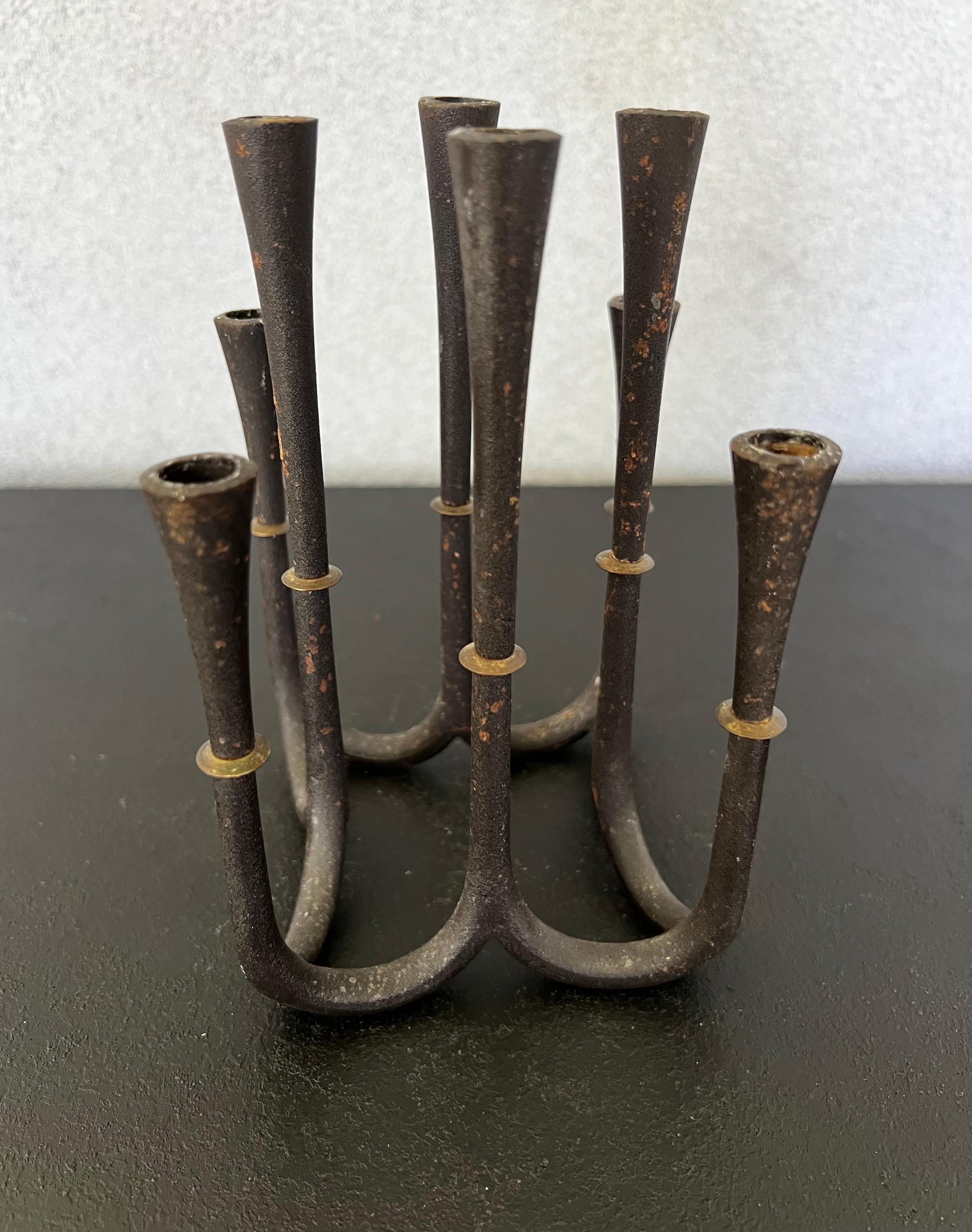 Mid-Century modern candelabra by Jens Quistgaard for Dansk. Features solid cast iron with brass accents, holds eight candles. Made in Denmark circa 1960s
Beautiful Design to be considered a world of art 
