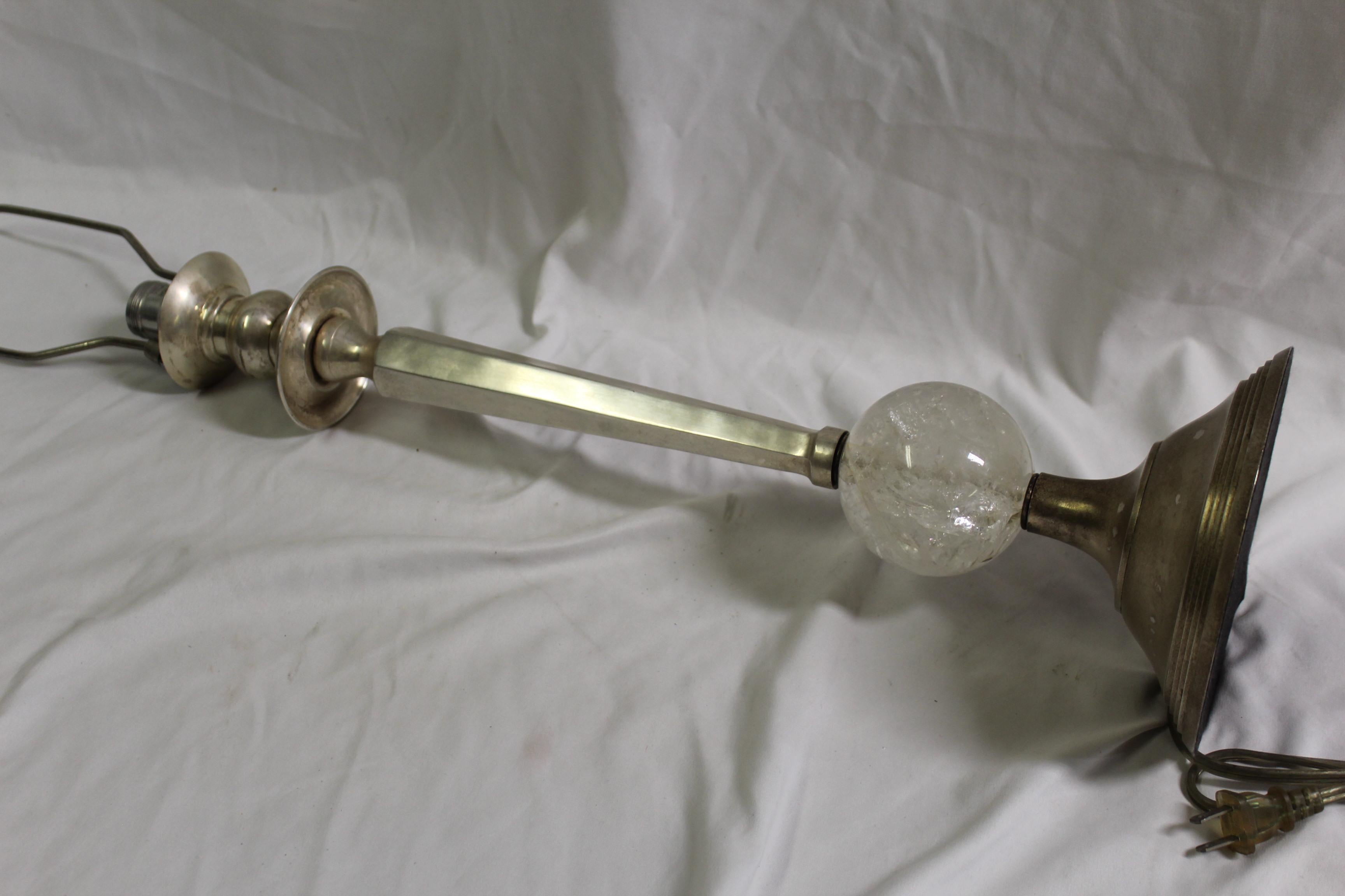A tall silvered finish candlestick made into a lamp. Solid brass with a silver patina. Tall at 31