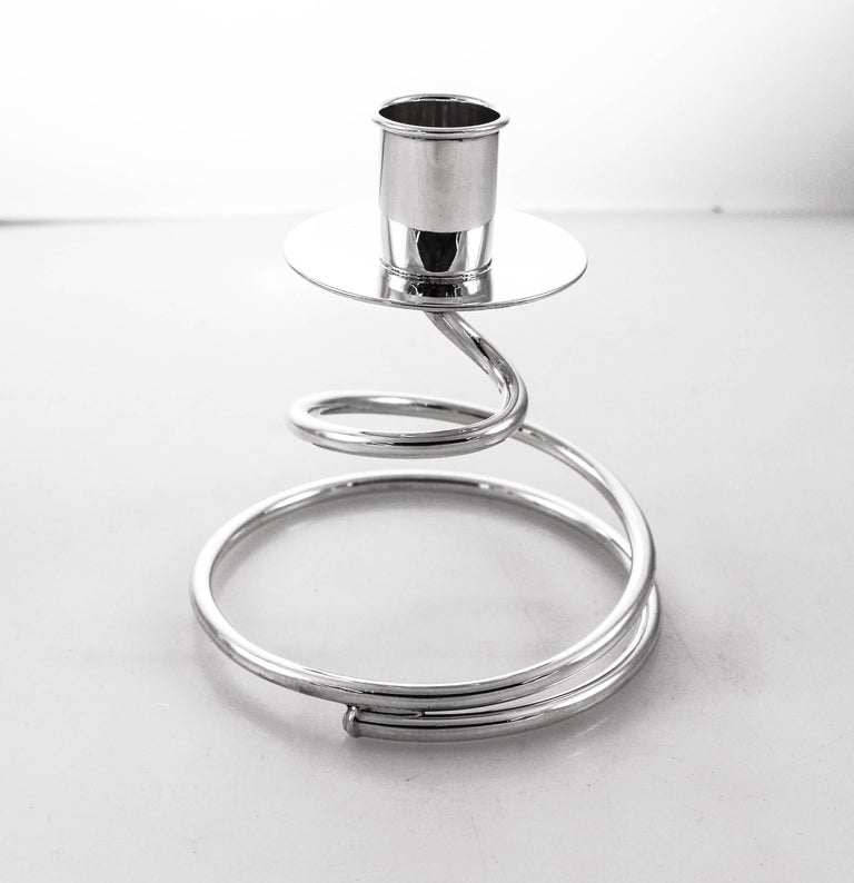 We proudly offer these sterling silver midcentury candlesticks. A spring-like shape substitutes for a conventional base. They’re uber-cool, young and modern. Neither ornate and heavy nor stuffy and serious these candlesticks are unique.