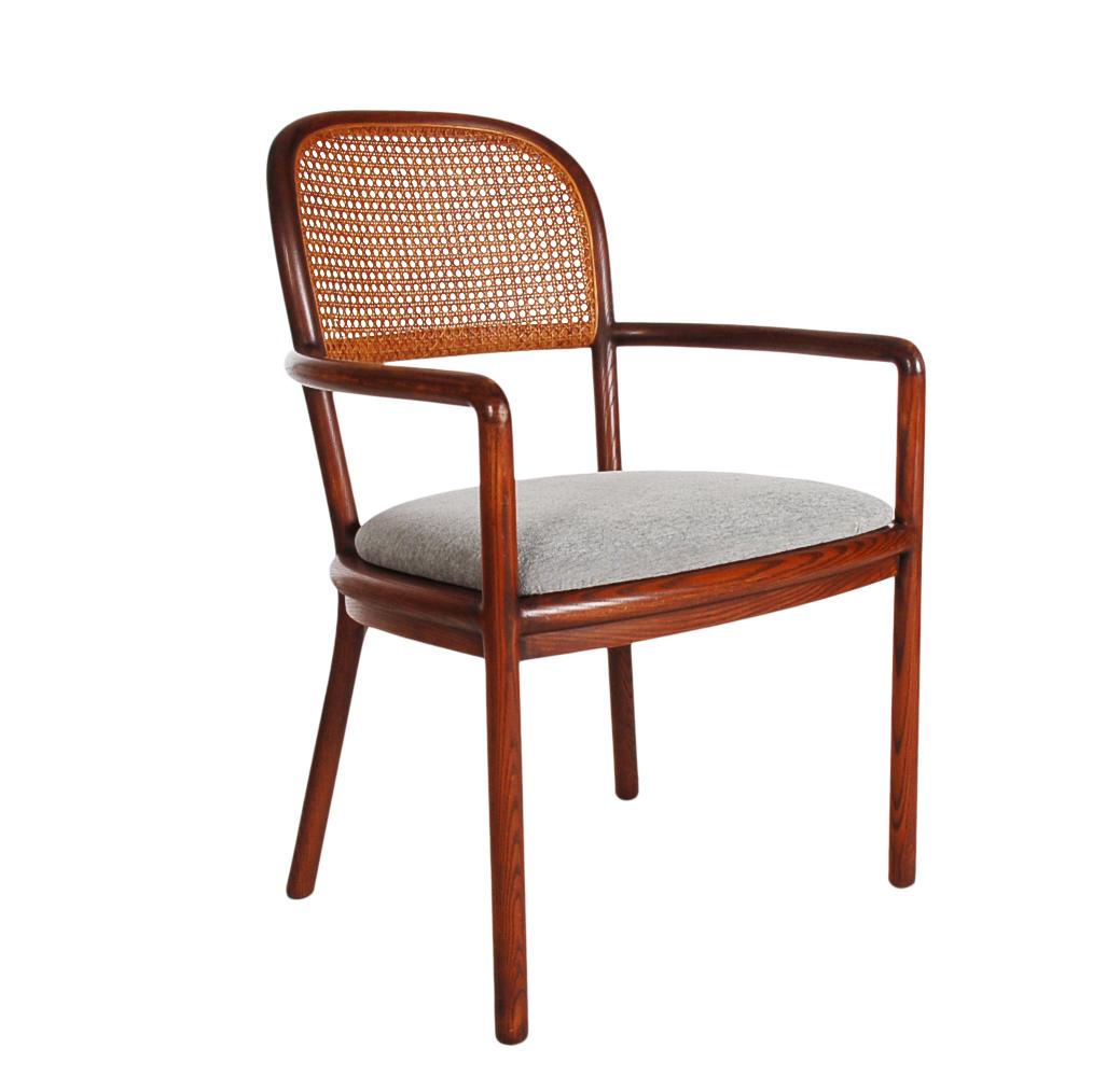 A handsome armchair designed by Ward Bennett and produced by Brickel Associates. It features solid high quality construction in oak, with caned backs, and new seat upholstery. Manufacture paper labels under seat.