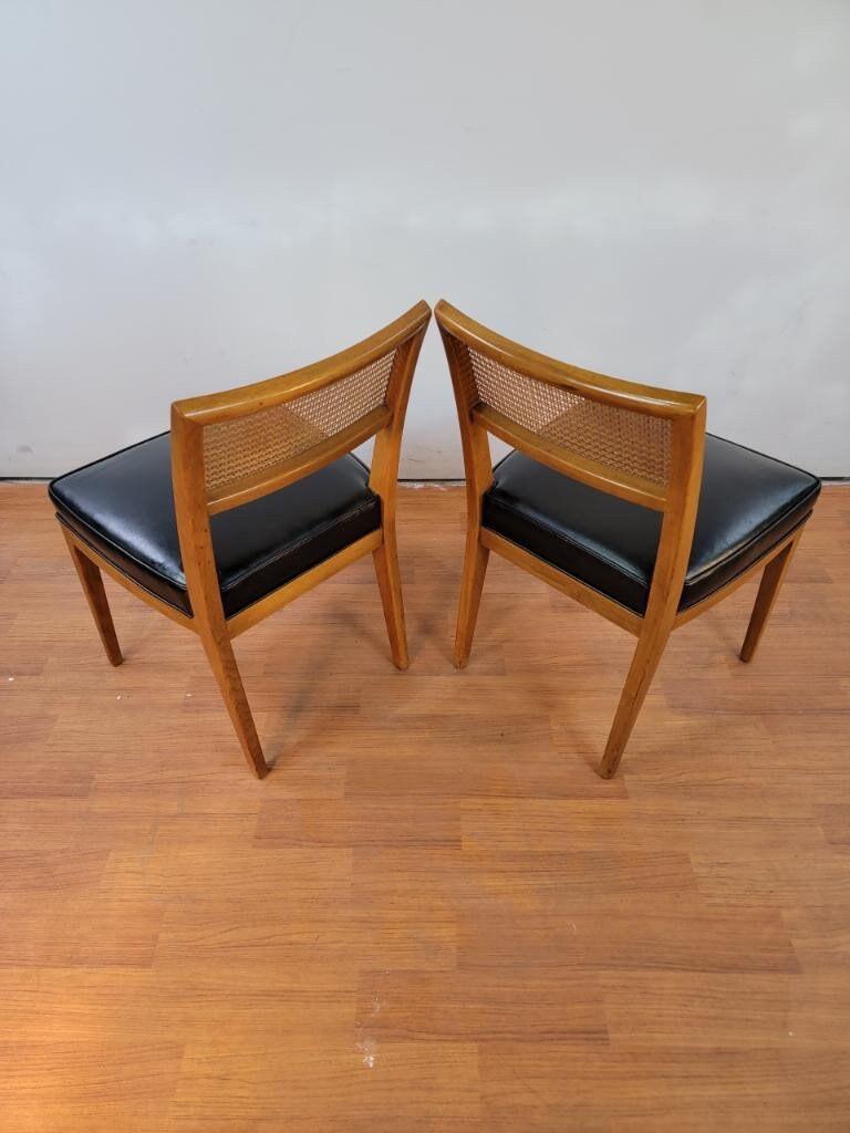 Mid-Century Modern cane back dining chairs for Drexel - Set of 6.

Gorgeous Mid-Century Modern dining set - comes with 2 armchairs and 4 Side Birchwood Cane Back Dining Chairs with Original Boxed Black Leather-like Upholstered Seat Cushions