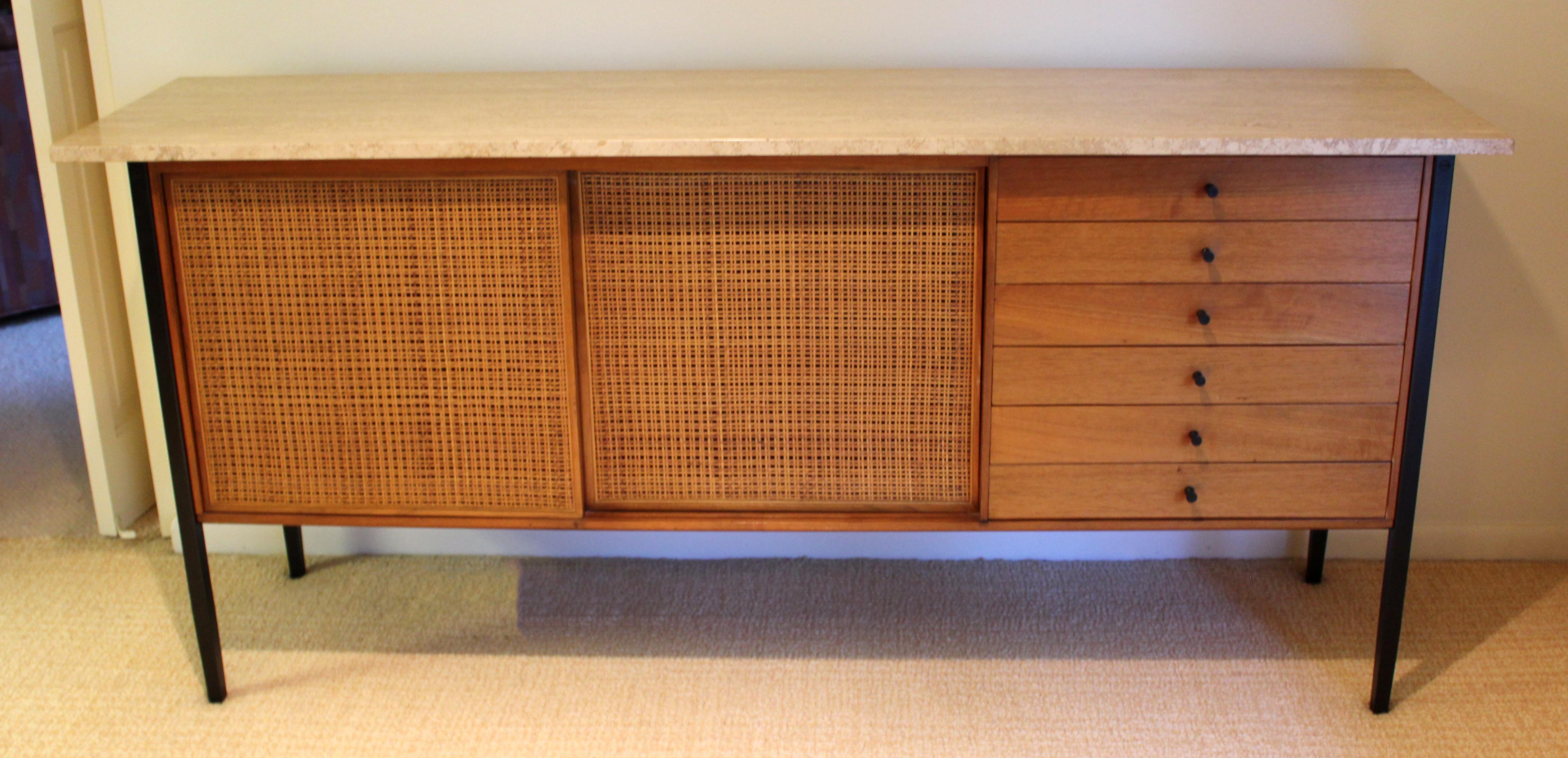 For your consideration is an incredible, marble topped, cane front, wood credenza, with two sliding doors, by Milo Baughman for Arch Gordon, circa the 1960s. In excellent vintage condition. The dimensions are 72