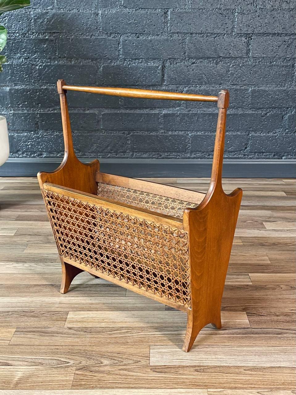 Condition: Original Vintage Condition

Materials: Walnut-Stained Maple Wood, Original Cane 

This elegant Mid-Century Modern cane magazine rack from the 1960s is a perfect blend of function and style, adding a touch of warmth and texture to any