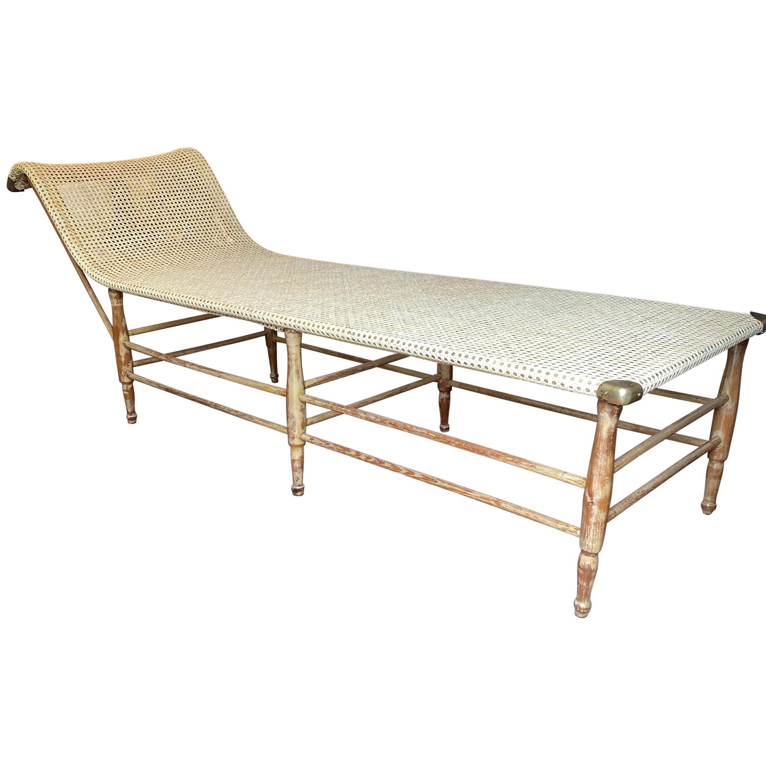 Early Mid-Century Modern caned daybed with brass hardware.

   