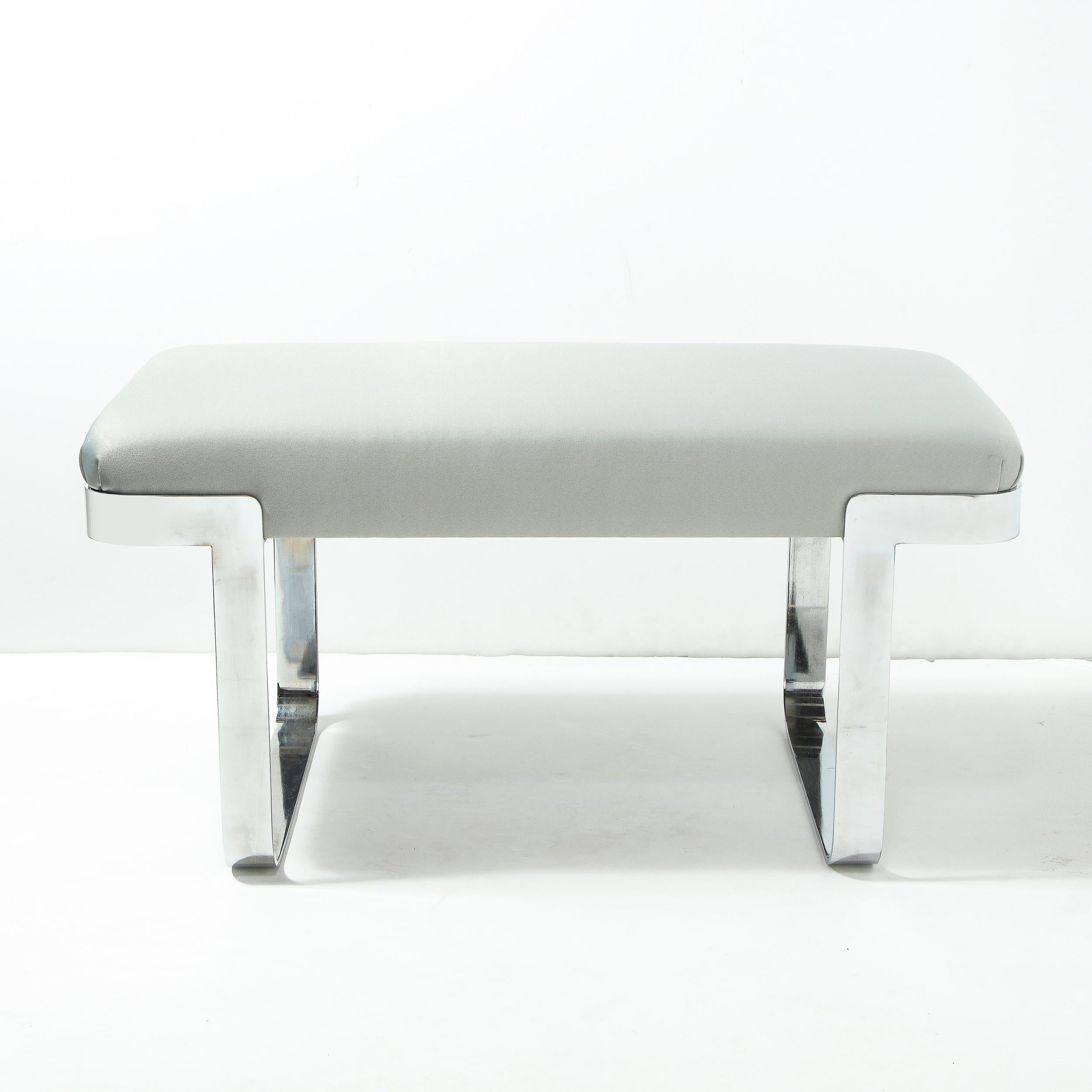 This chic and refined Mid-Century Modern bench was realized in the United States, circa 1980. It features inverse L-form feet in lustrous chrome that create a cantilevered profile. The seat, offering elegantly considered proportions, has been newly