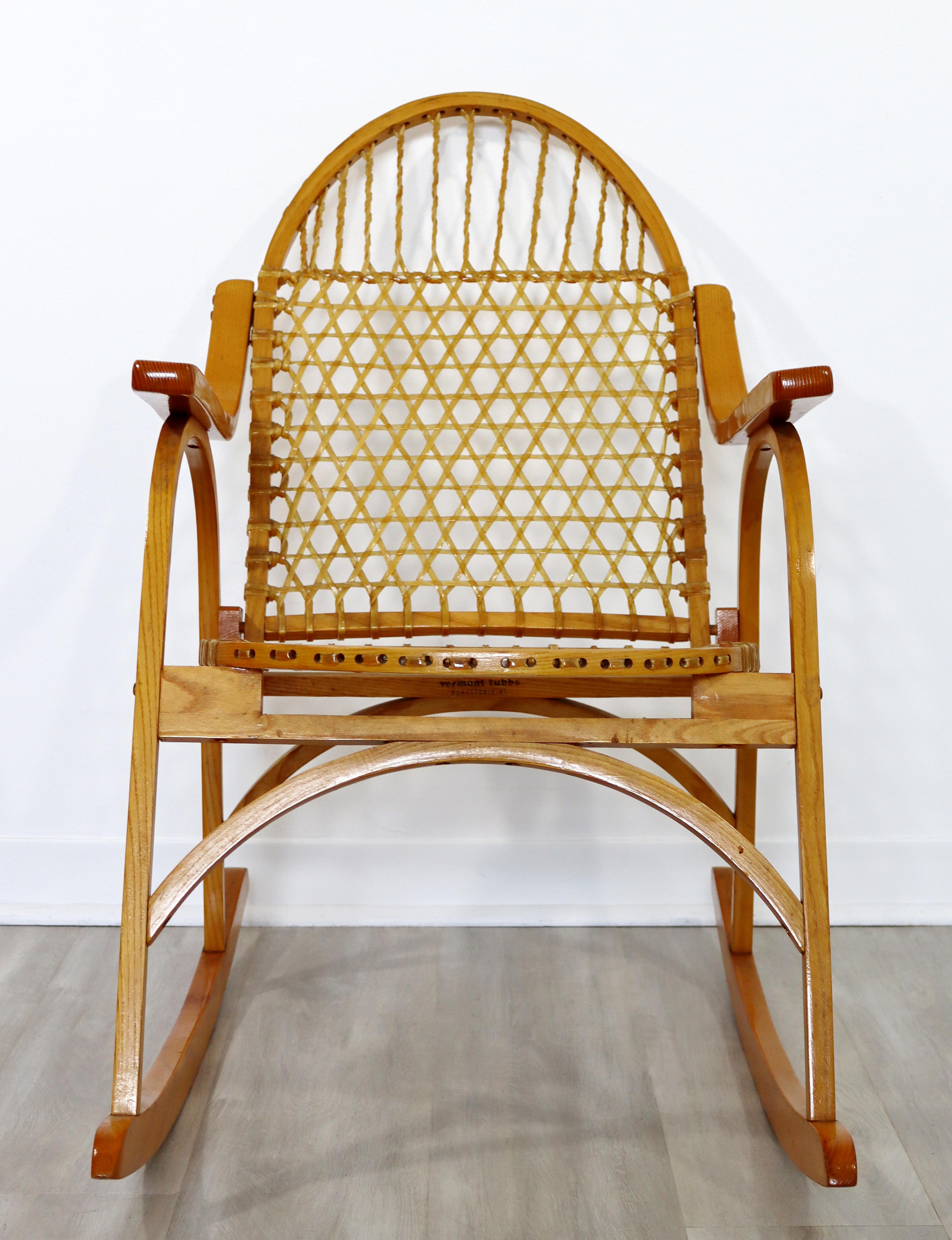For your consideration is an eccentric accent rocking chair, with raw hide webbing, by Carl Koch for Vermont Tubbs, circa the 1950s. In excellent vintage condition. The dimensions are 20.5