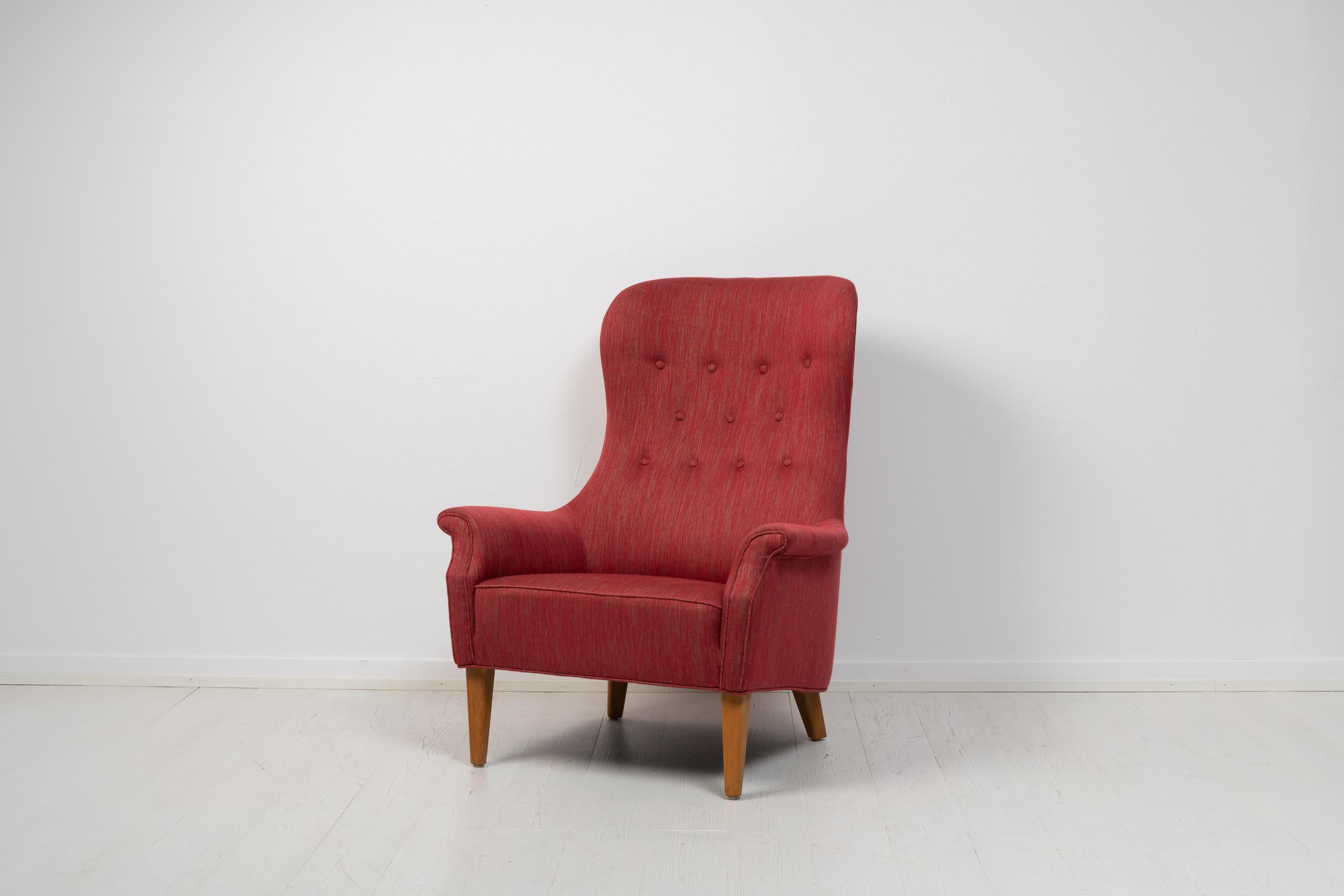 Scandinavian modern armchair by Carl Malmsten from Sweden made during the mid 20th century, around 1960 to 1970. The armchair has the sleek lines and minimal design typical to the Scandinavian mid century modern design as well as Carl Malmsten