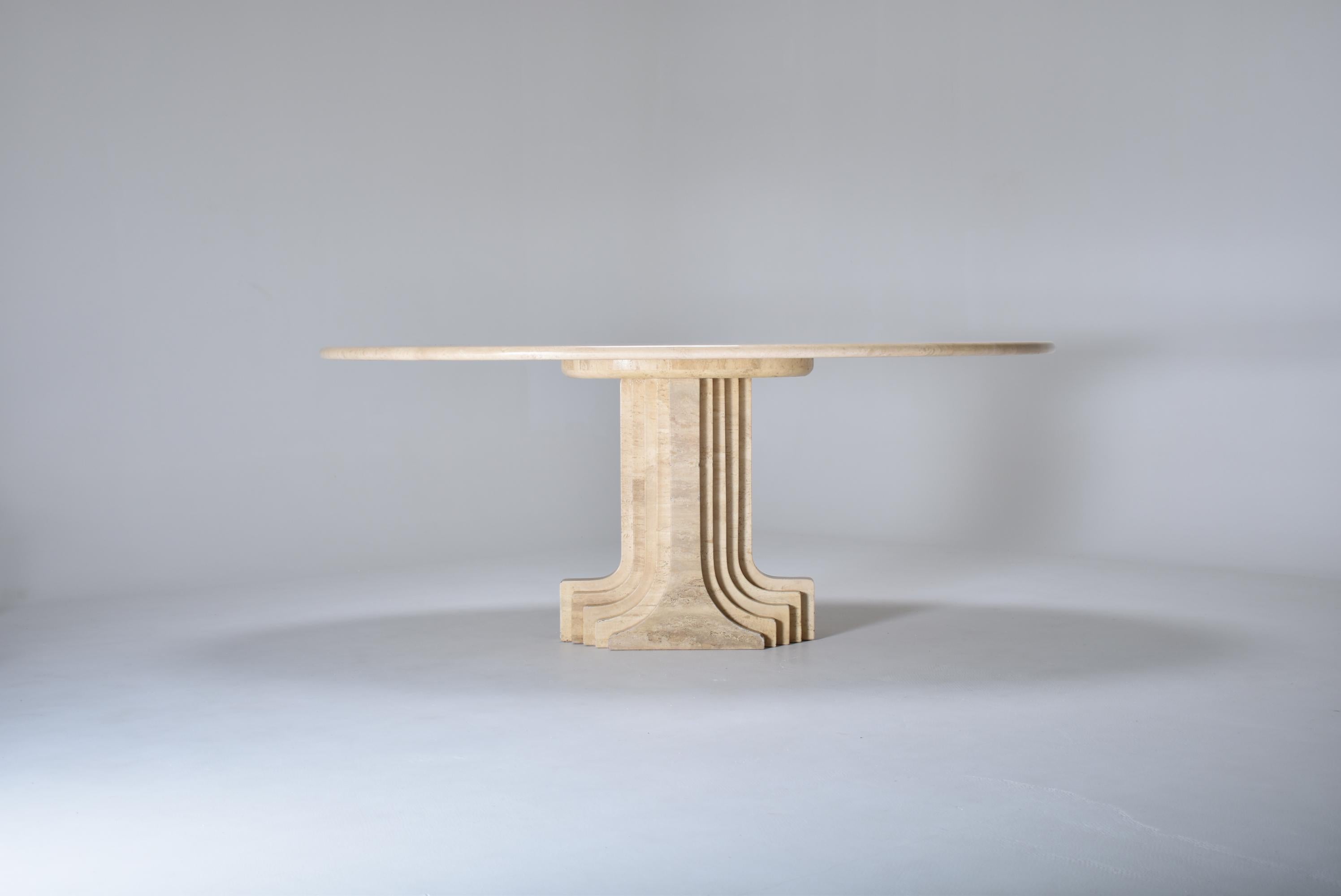 Mid-Century Modern oval travertine dining room table. 
Designed in 1970 by Carlo Scarpa (1906-1978) for the 