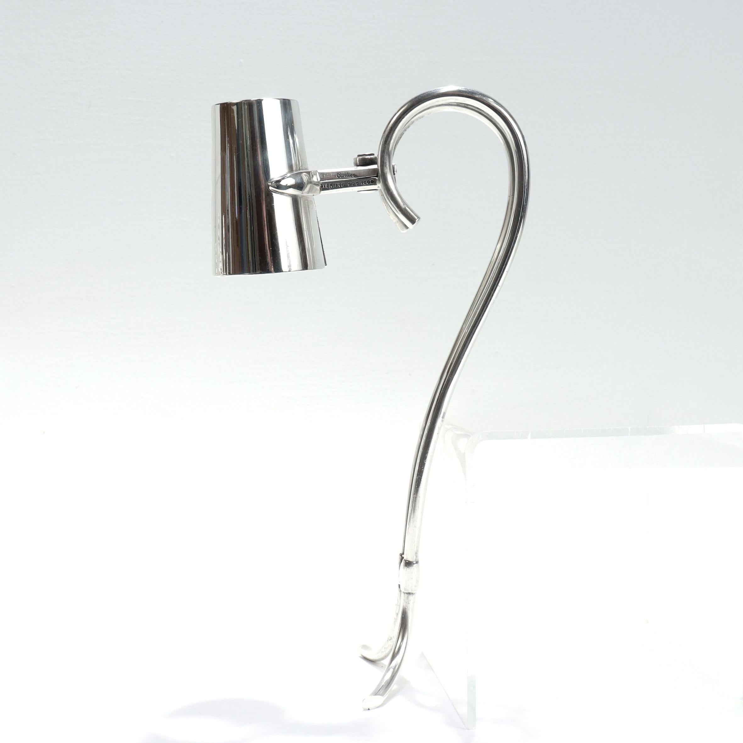 A fine vintage signed bottle holder.

By Cartier.

In sterling silver.

With scissor action and a two-part handle.

Fully marked to the side.

Simply a wonderful wine accessory from Cartier!

Date:
Mid-20th Century

Overall Condition:
It is in