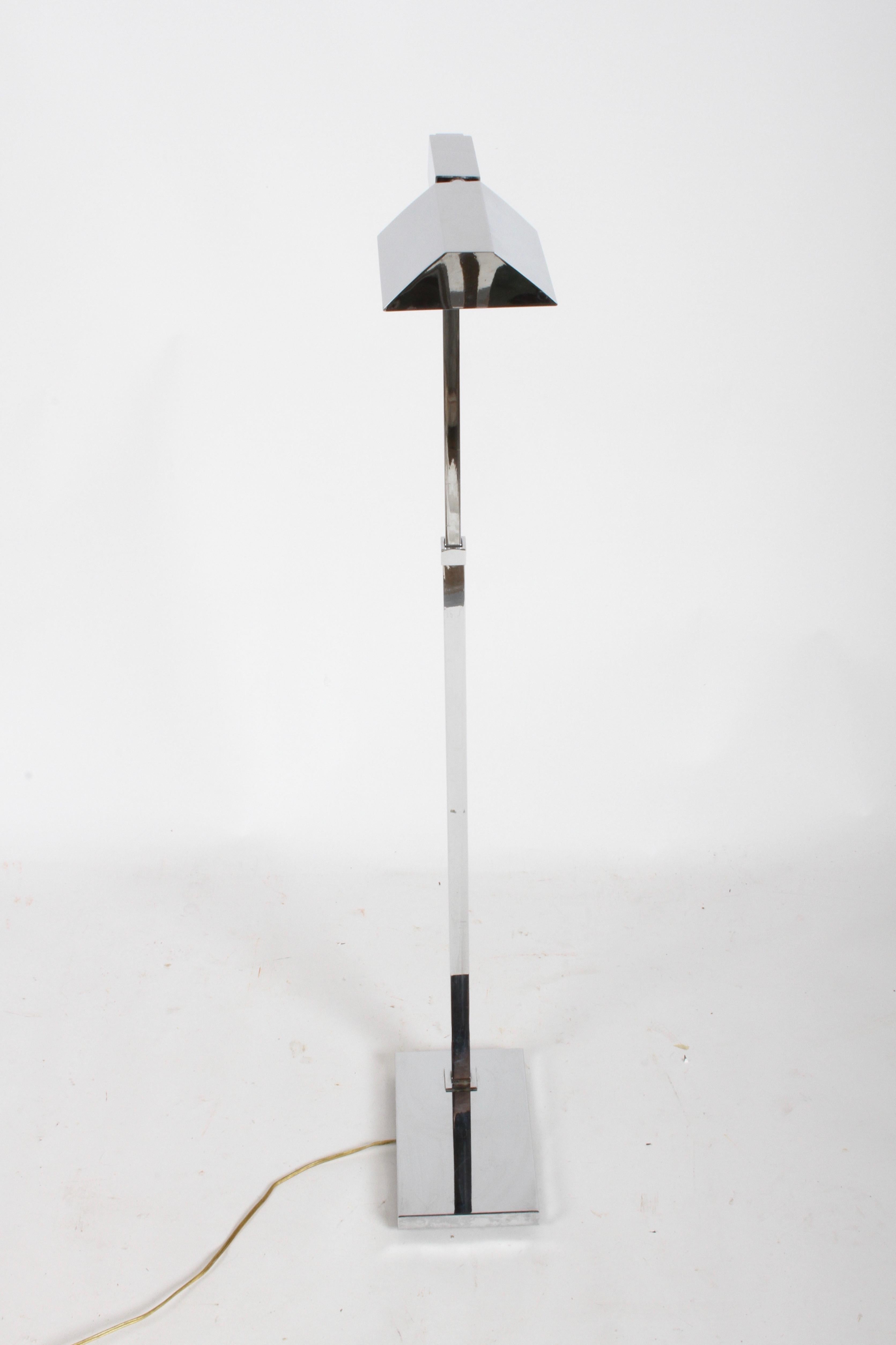 Mid-Century Modern Casella of San Francisco, chrome fully adjustable floor pharmacy reading lamp on rectangular base. Shade is adjustable, along with up and down positions and 360° side motion. Adjust from 34.25