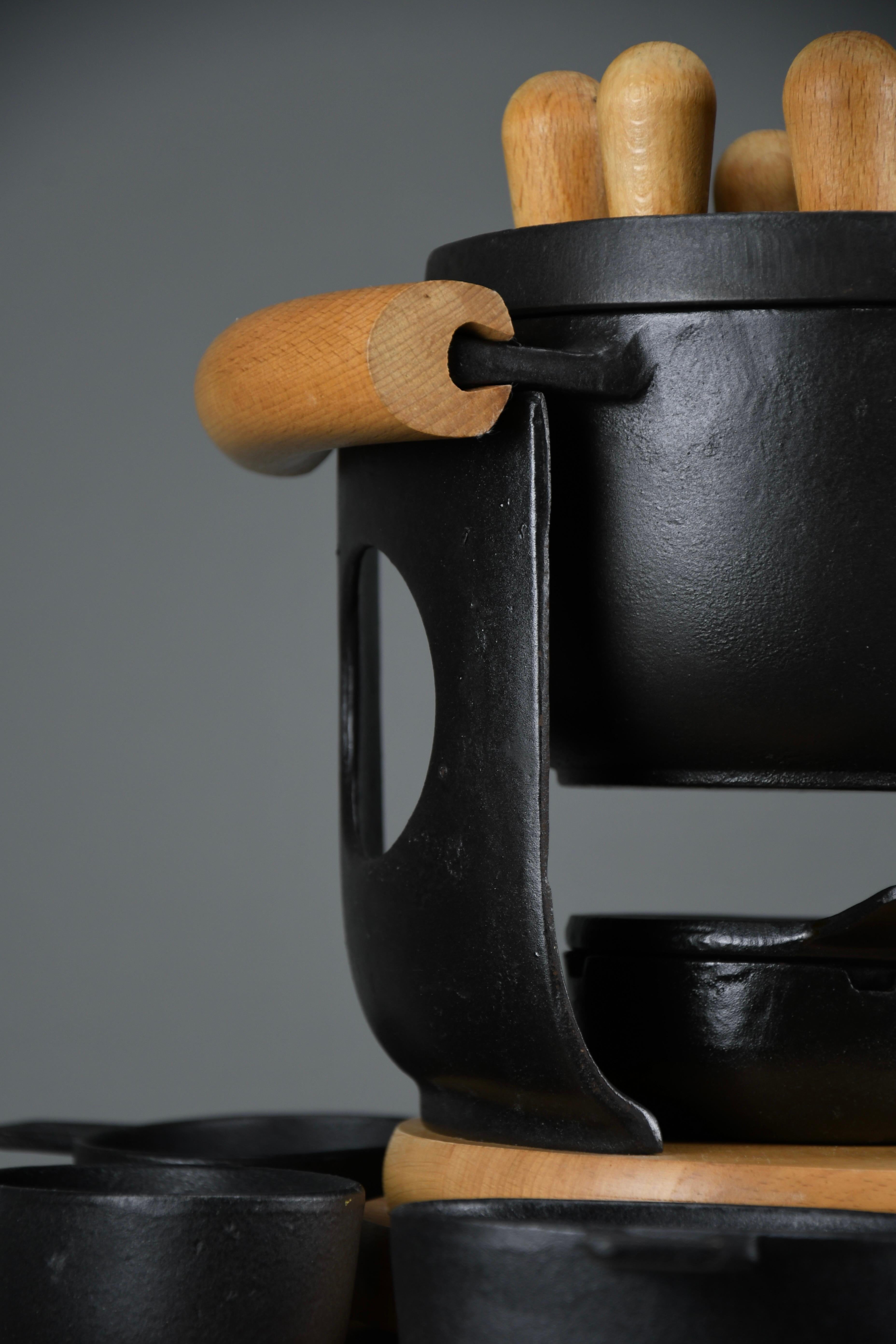Danish Mid-Century Modern Cast Iron and Wood Fondue Set by Richard Nissen for Bodum For Sale
