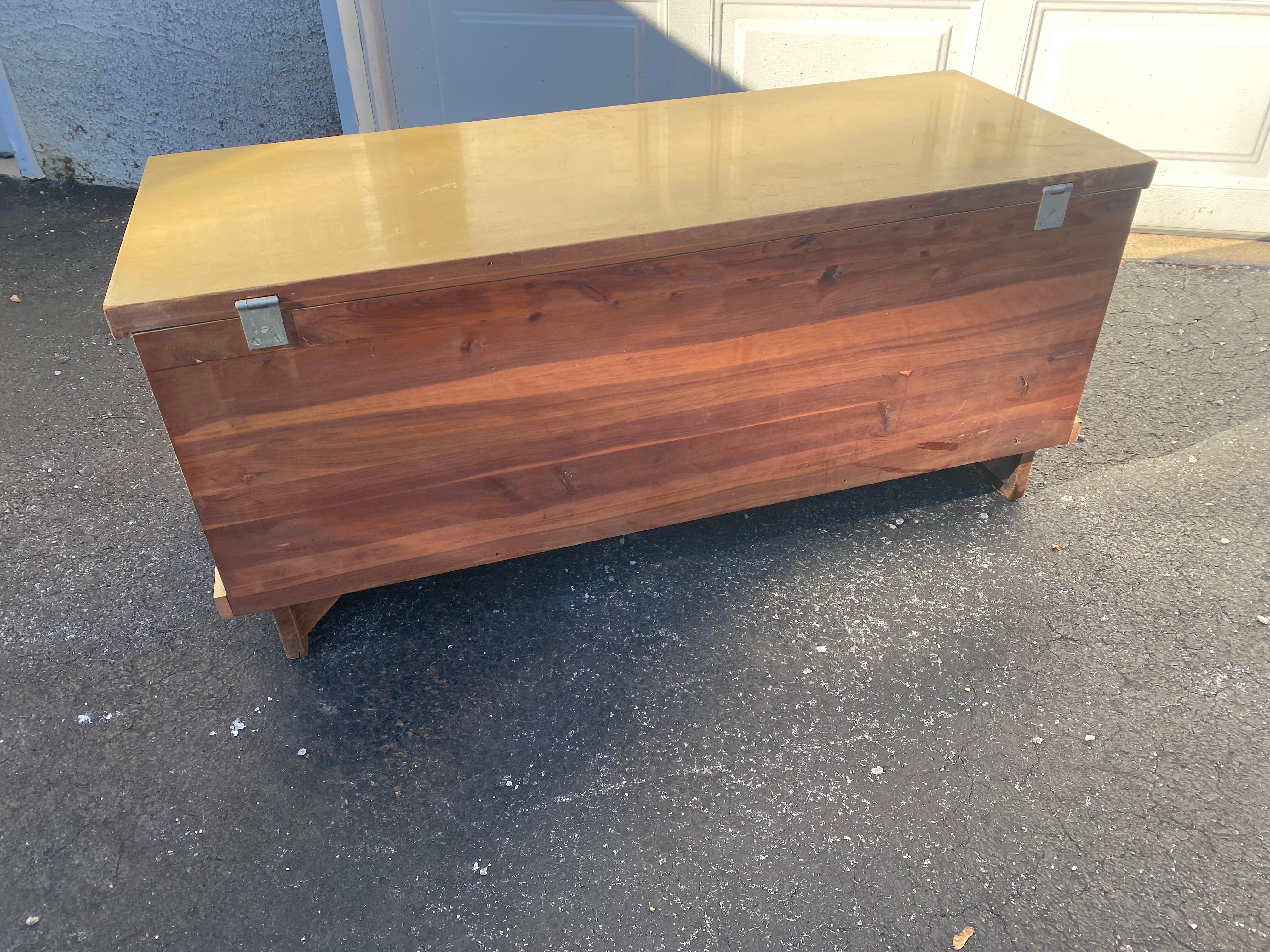 Cedar chest by Lane Furniture, Inc., Altavista Virginia. Original finish in a cream-yellow color with original hardware, including original key. Cedar interior with automatic tray lined with green felt. Style No. 7931-23, Serial No. 751190.