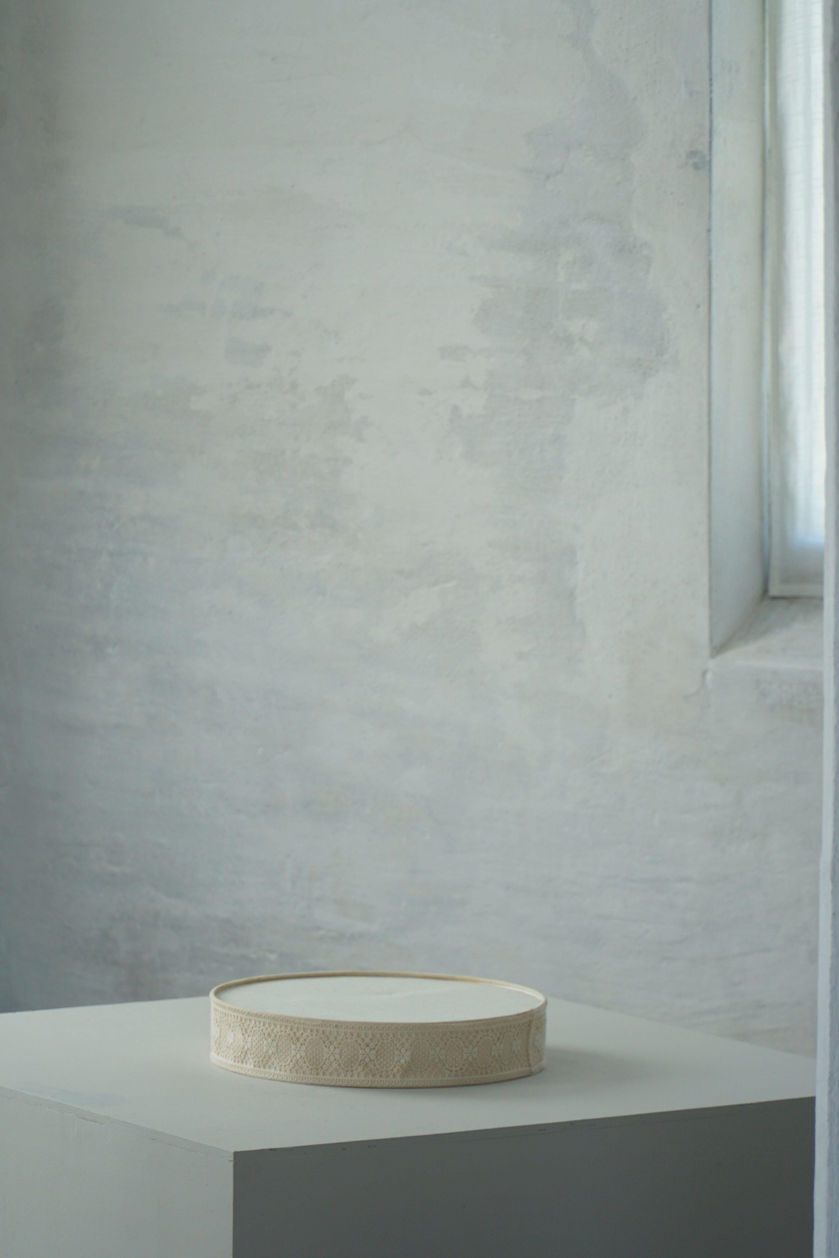 This elegant Swedish sconce from the 1950s beautifully captures the essence of mid-century simplicity, enhanced by subtle decorative touches. Designed for use as either a ceiling or wall fixture, it features a softly structured linen shade that