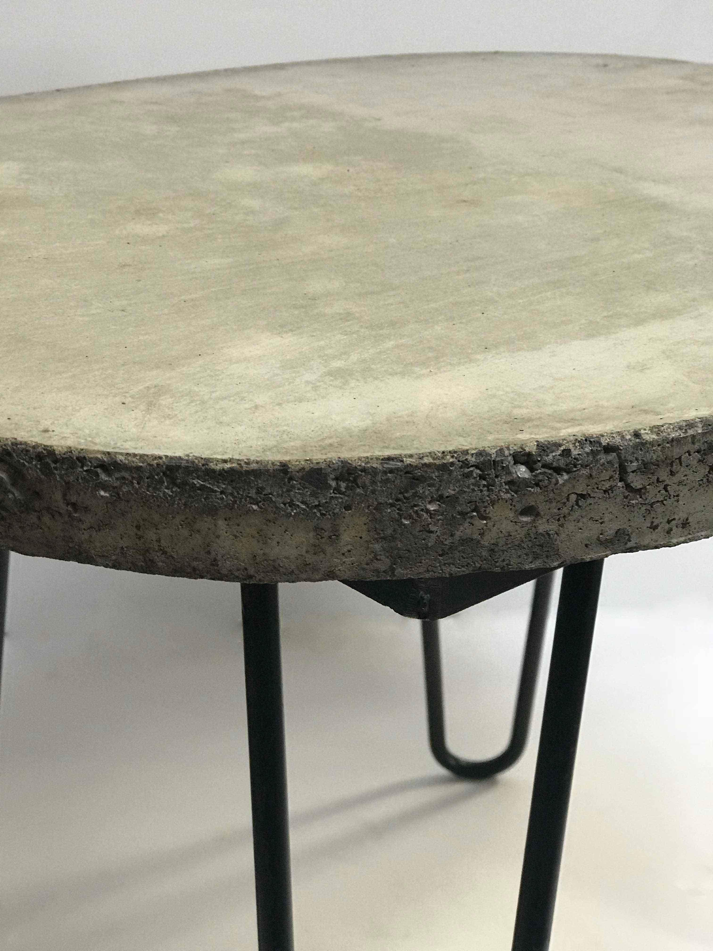 Mid-century modern cement barrel side tables on iron bases.
