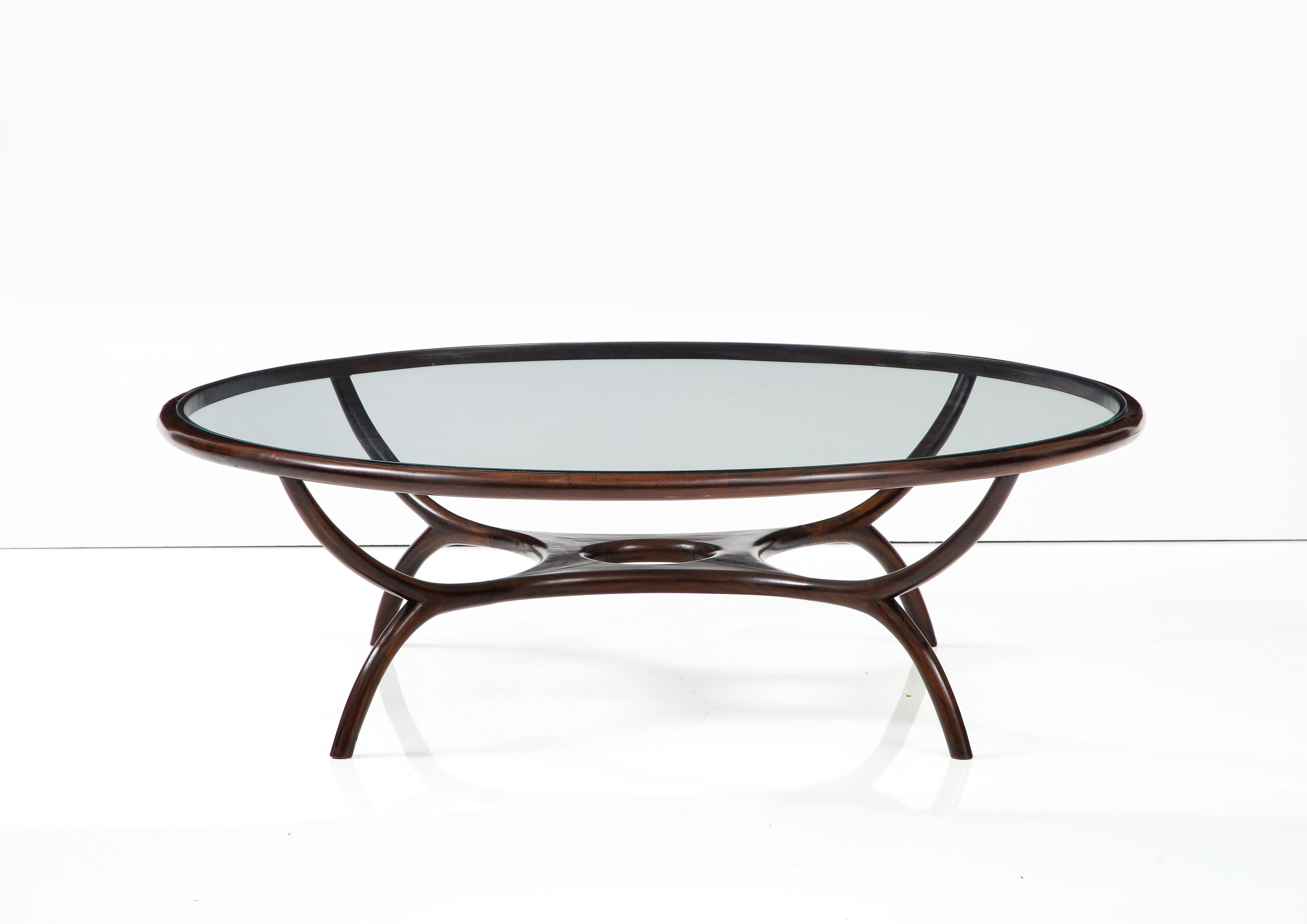 Mid-Century Modern Wood and Glass Center Table by Giuseppe Scapinelli, Brazil, 1960s

The Giuseppe Scapinelli center table is structured in solid wood with a nested glass top.
The nested glass top and the curvature of the legs are the outstanding