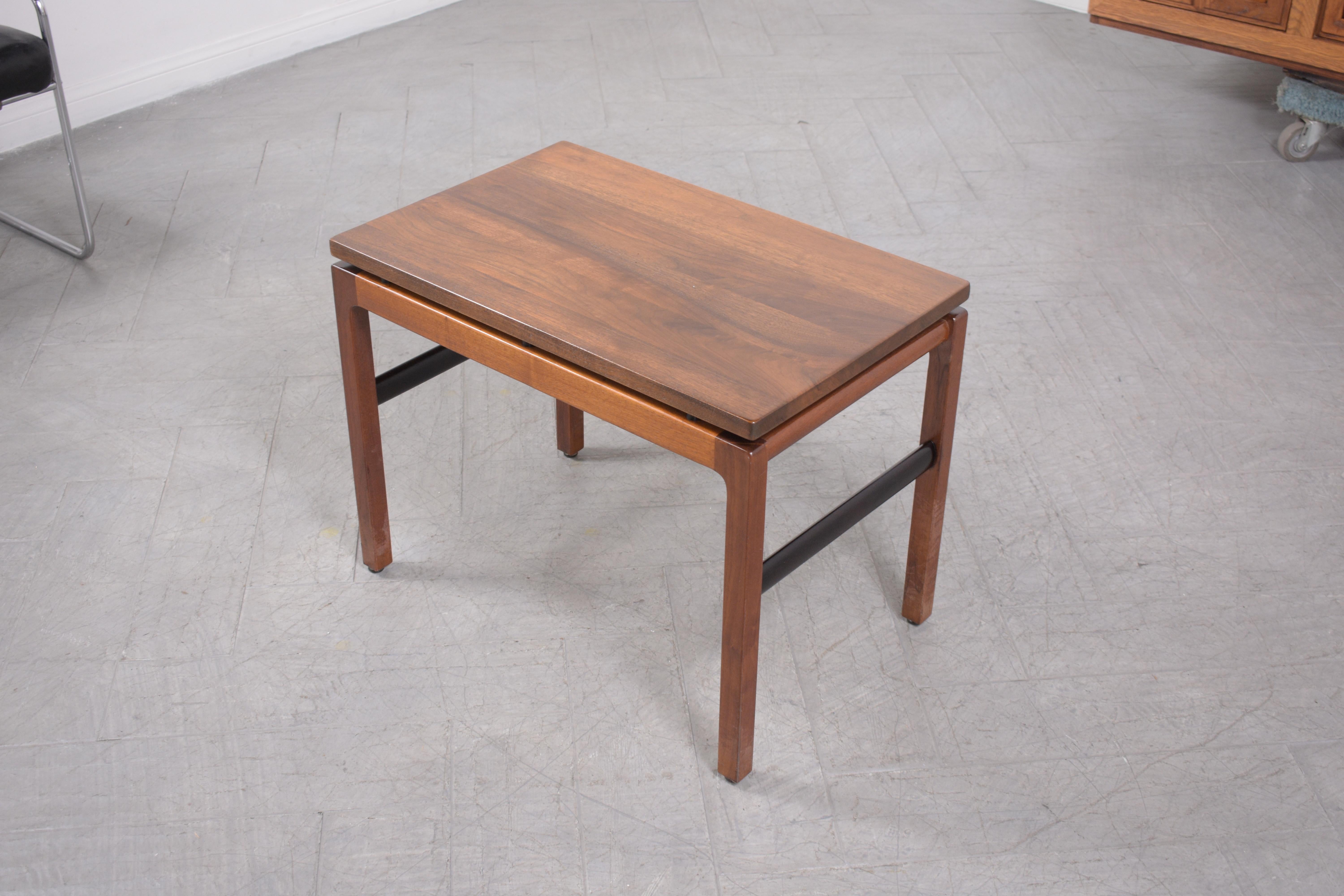 Embrace the timeless allure of the 1960s with our meticulously restored Mid-Century Modern Side Table. Crafted to perfection using premium walnut wood, this vintage gem stands in impeccable condition, having been revitalized by our dedicated