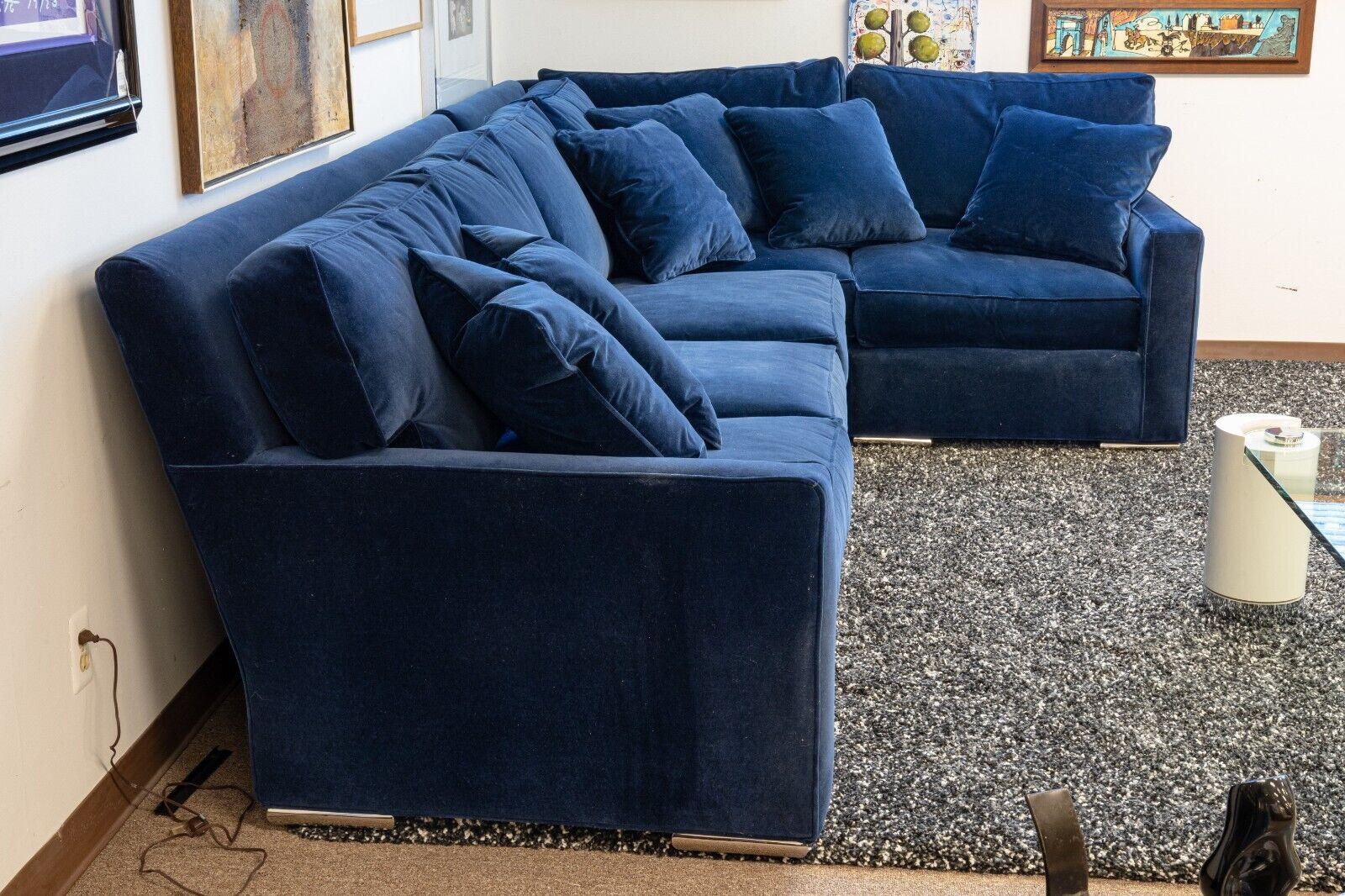 A Century Furniture blue velvet and chrome sofa sectional. This wonderous sofa sectional features a deep blue velvet upholstery with chrome detailing on the legs, and a three piece sectional design. The blue velvet that covers the entirety of this