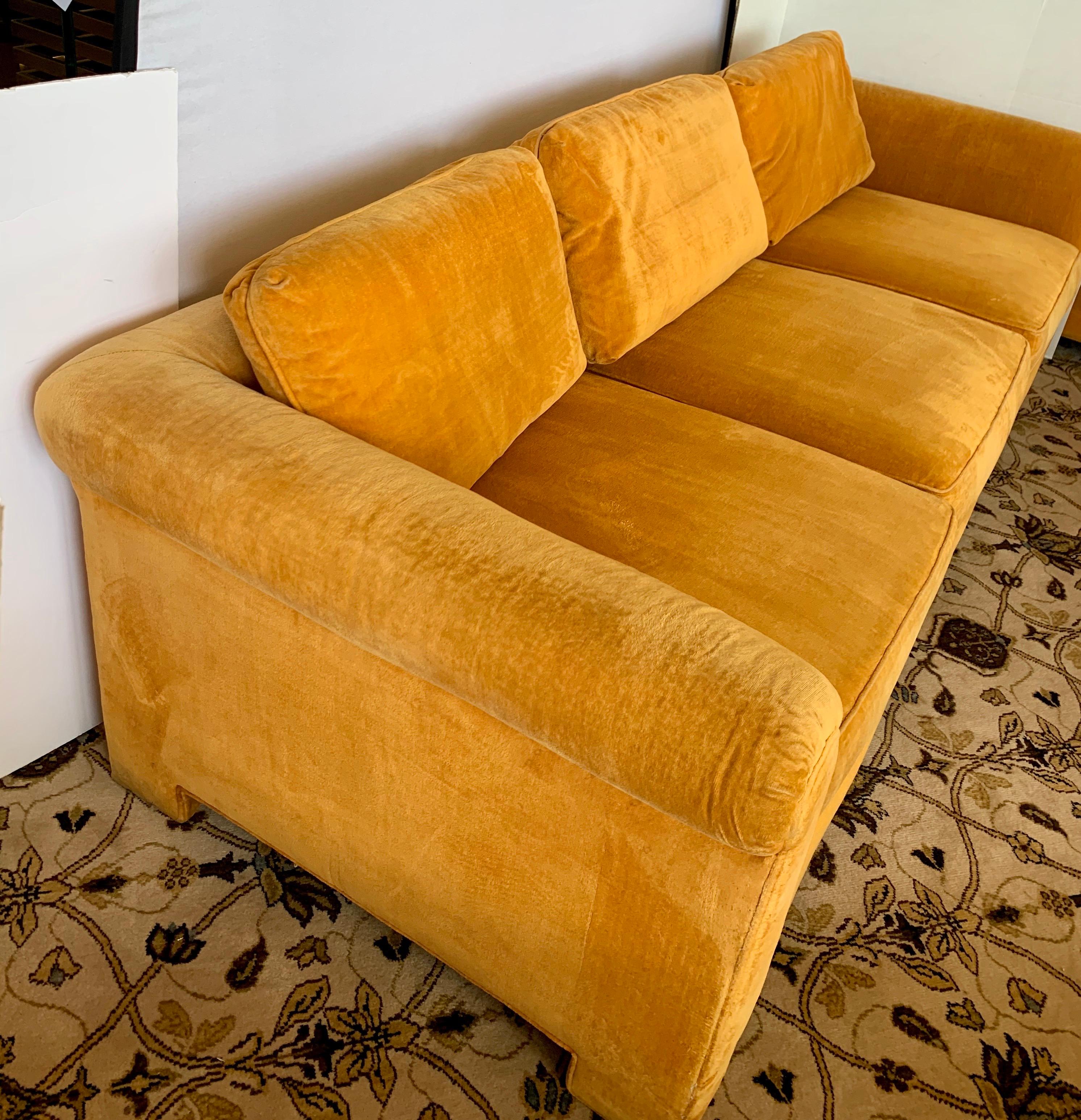 Rare and coveted signed Century Furniture sofa with original Hermès orange colored velvet fabric.
The fabric is original and still in decent condition with normal age appropriate wear. The seats sit a little on the less firm side and the sofa is low