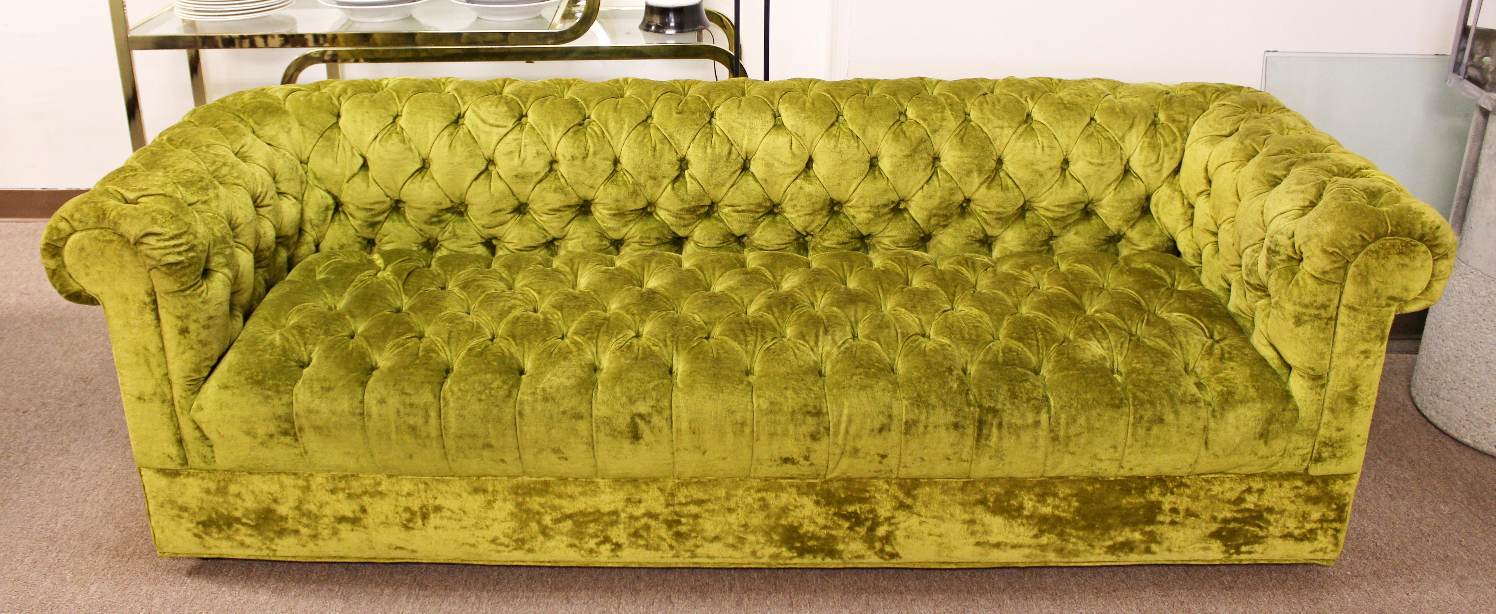 For your consideration is a gorgeous, green, tufted sofa on casters, by Century, in the style of Milo Baughman, circa 1960s. In excellent condition. The dimensions are 87