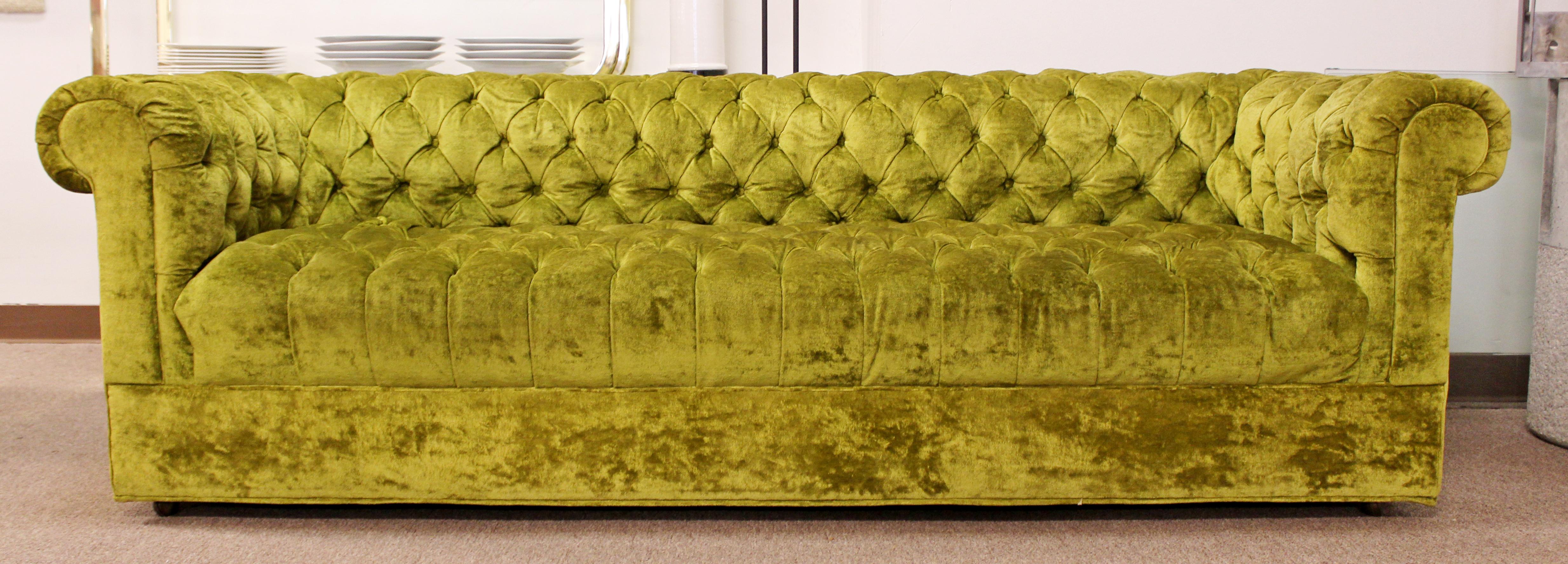 For your consideration is a gorgeous pair of green, tufted sofa on casters, by Century, in the style of Milo Baughman, circa 1960s. In excellent condition. The dimensions are 66