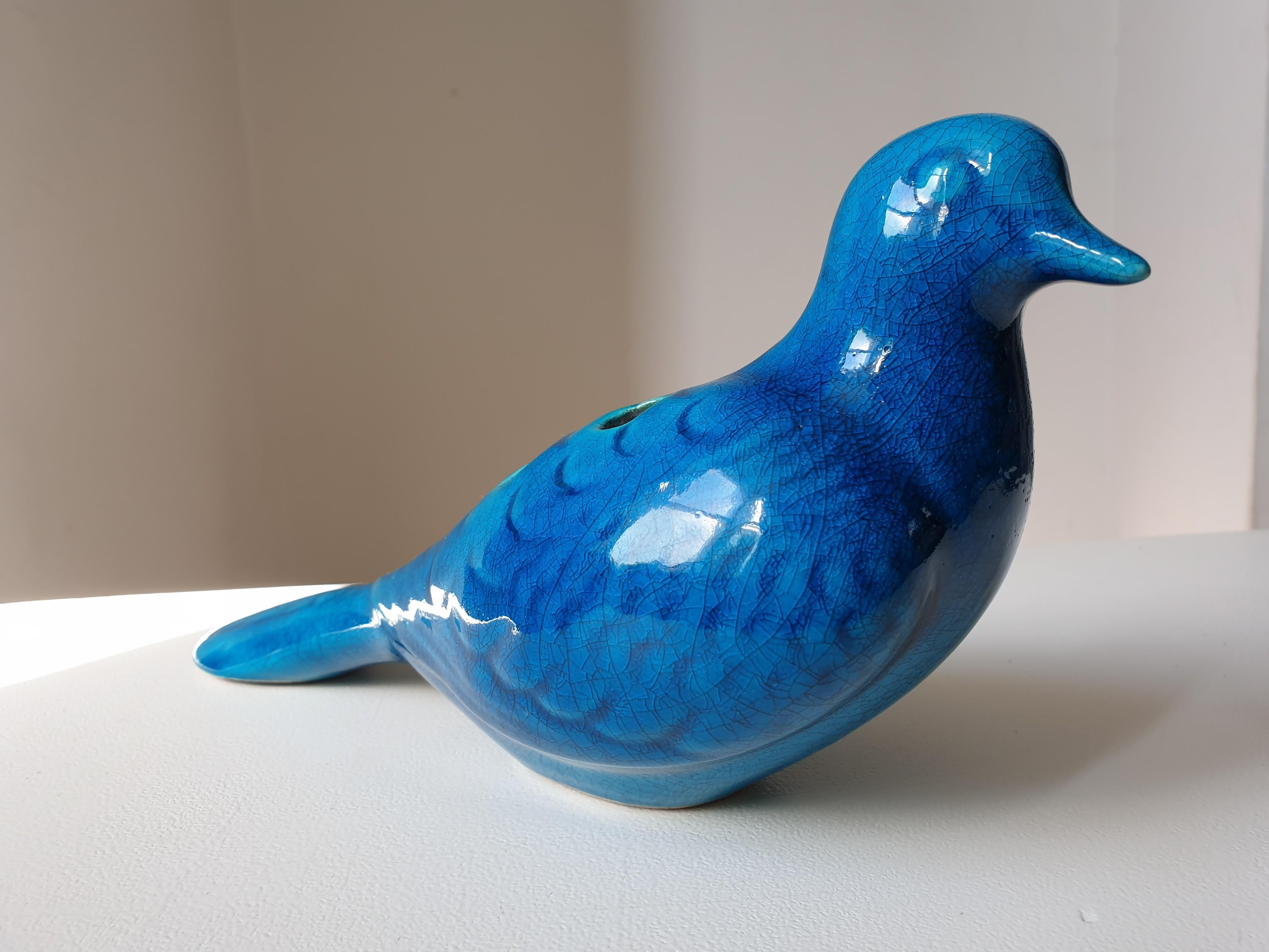 Glazed ceramic pigeon with a crackle glazed finish by the celebrated French ceramicist Pol Chambost. Signed to base. There are openings in the back for sprigs of flowers making it ideal to use as a table decoration.