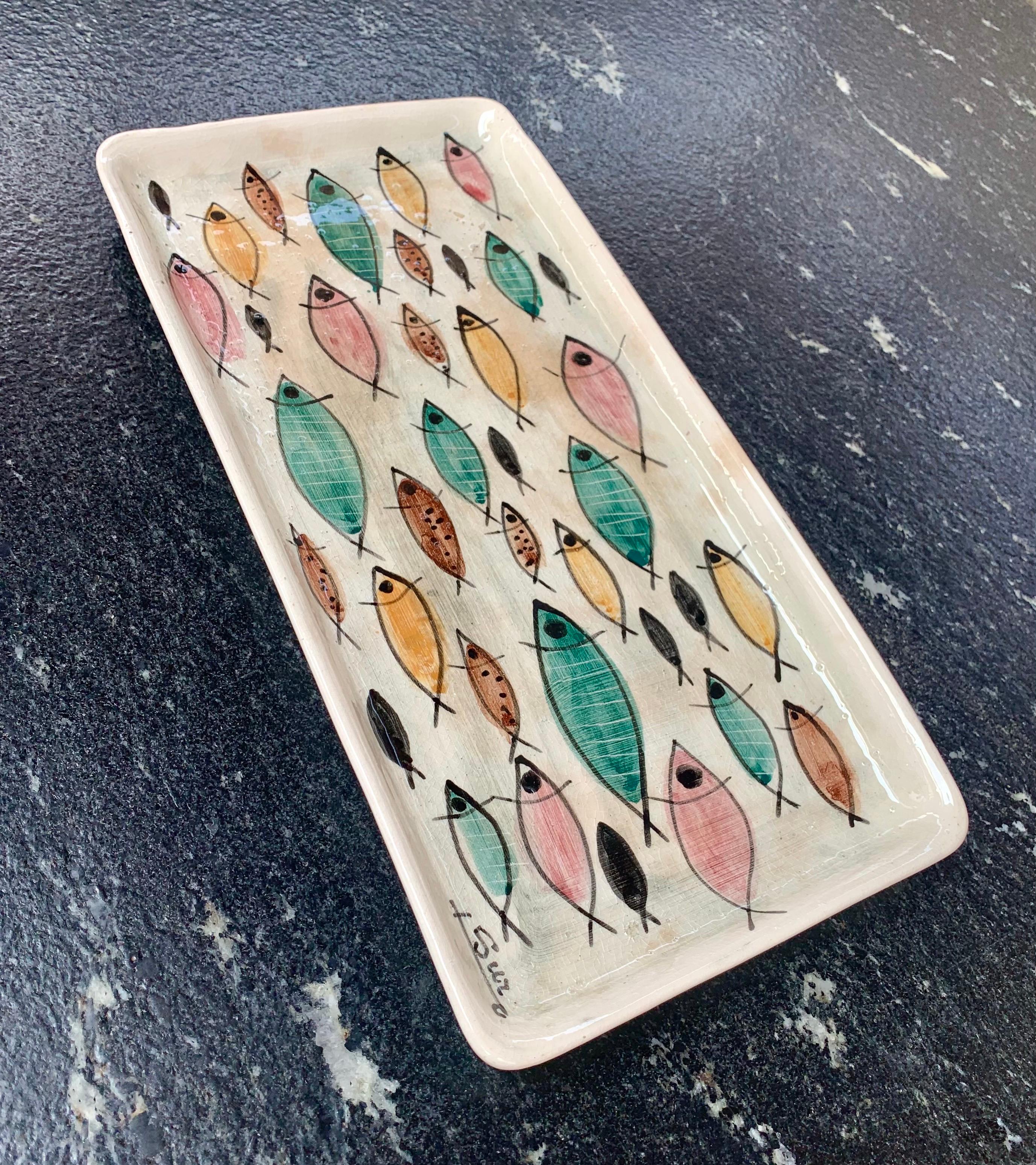 Exquisite glazed ceramic dish in various shades and colors with the iconic fish of the Mid-Century Modern has a unique personality. Designed and hand painted by Mexican ceramist and artist Noe Suro at his Workshop in Tlaquepaque, Jalisco, in the