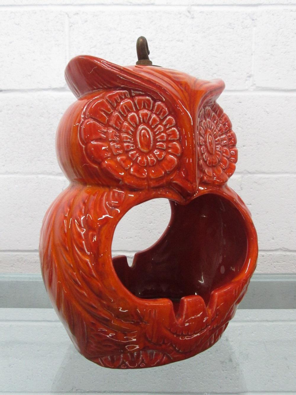 Mid-Century Modern ceramic hanging owl ashtray. Nice vibrant orange ceramic color.
   
