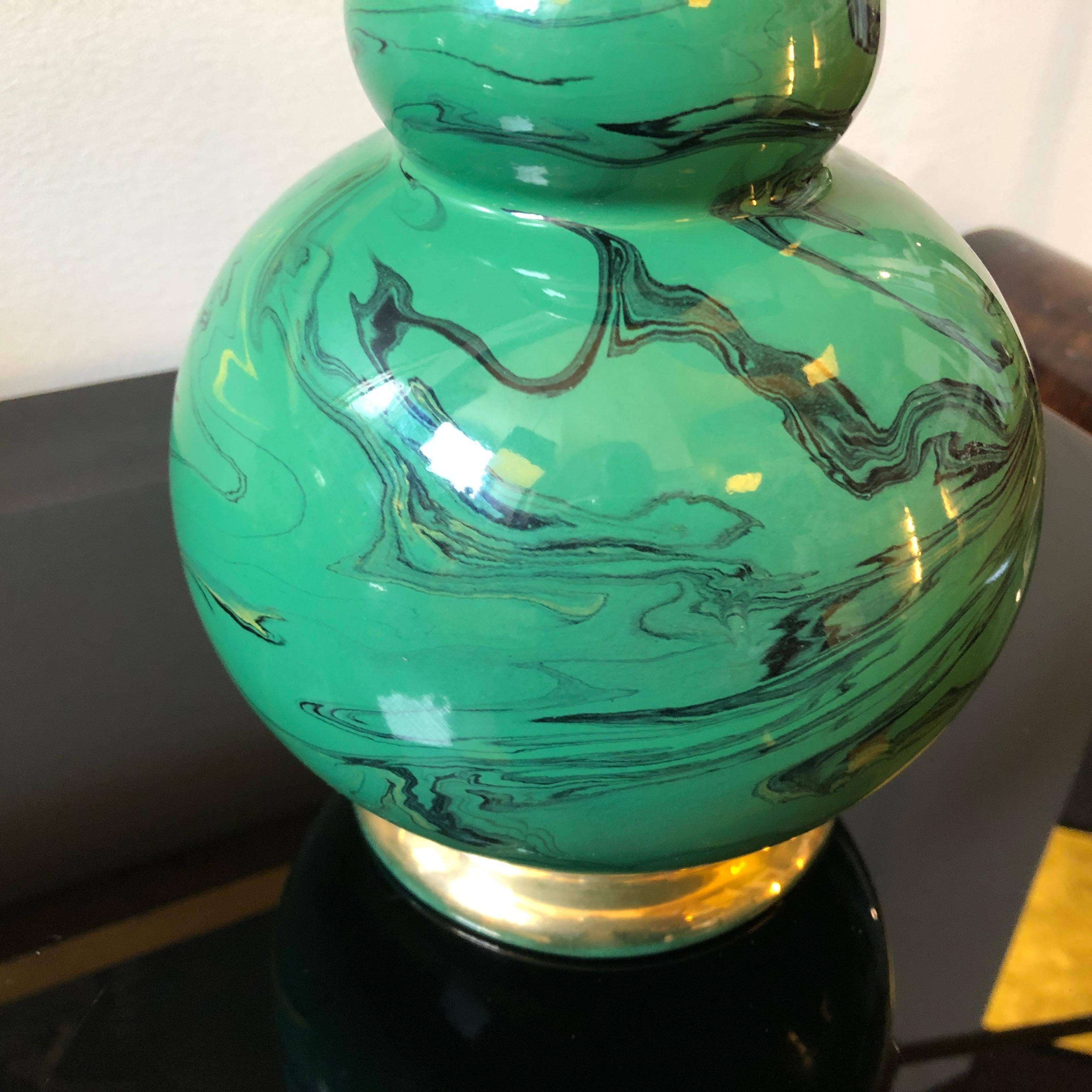 It's a gold and green malachite effect ceramic vase made in Italy in the 1950s by Batignani in Florence.