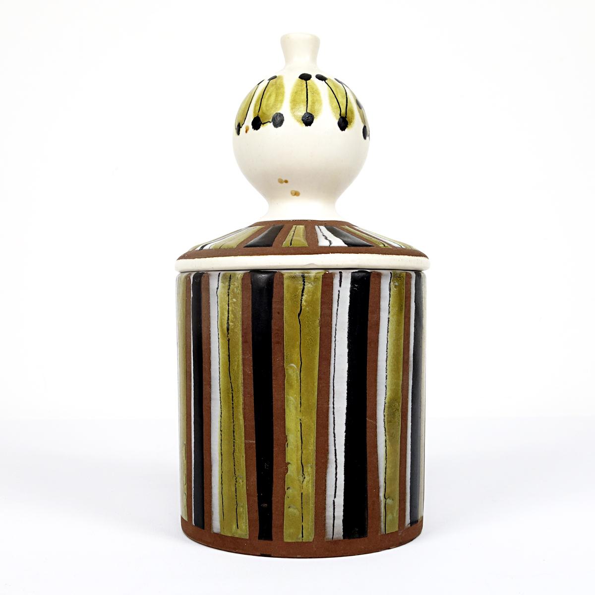 Beautiful Jar made by Roger Capron for Vallauris. The warm earthy colors and the freestyle shapes (especially that of the lid) makes this outstanding piece like candy to the eye.