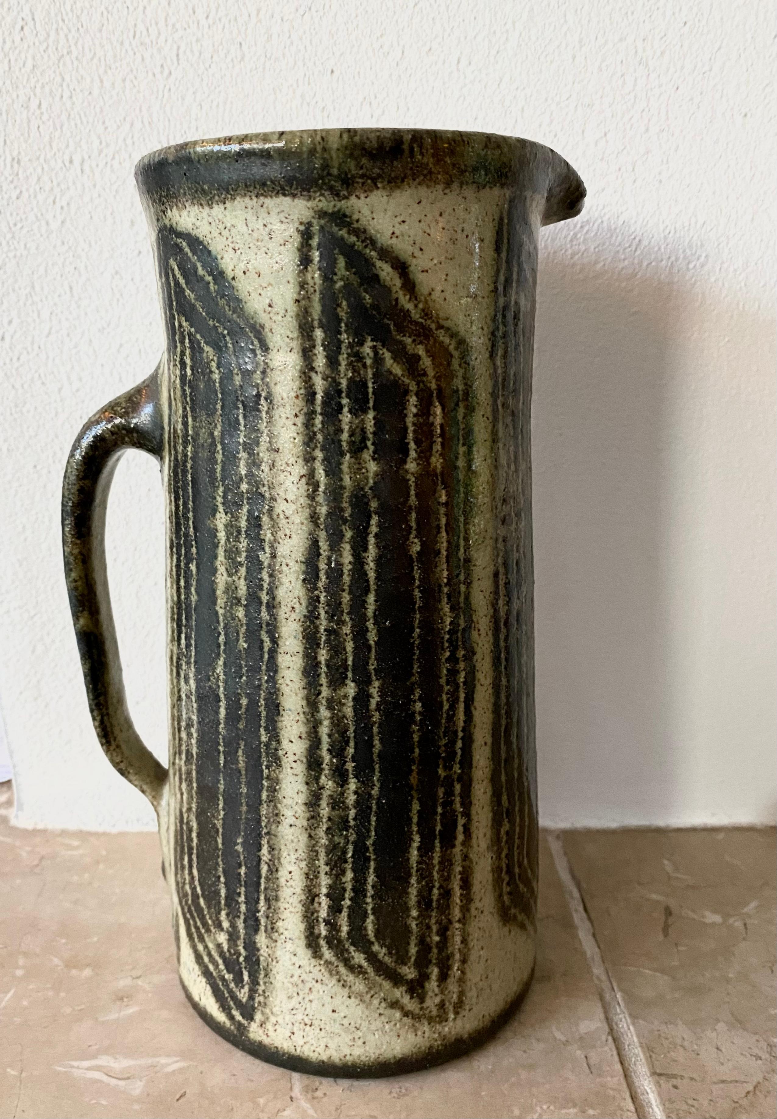 Stunning Glazed Ceramic Pitcher, Vase, with Brutalist, Abstract decoration. This stunning piece was made by the Dutch Artist Han Cornelissen, who was a student of Jan van Stolk. The piece remains in very good condition, with normal signs of age and