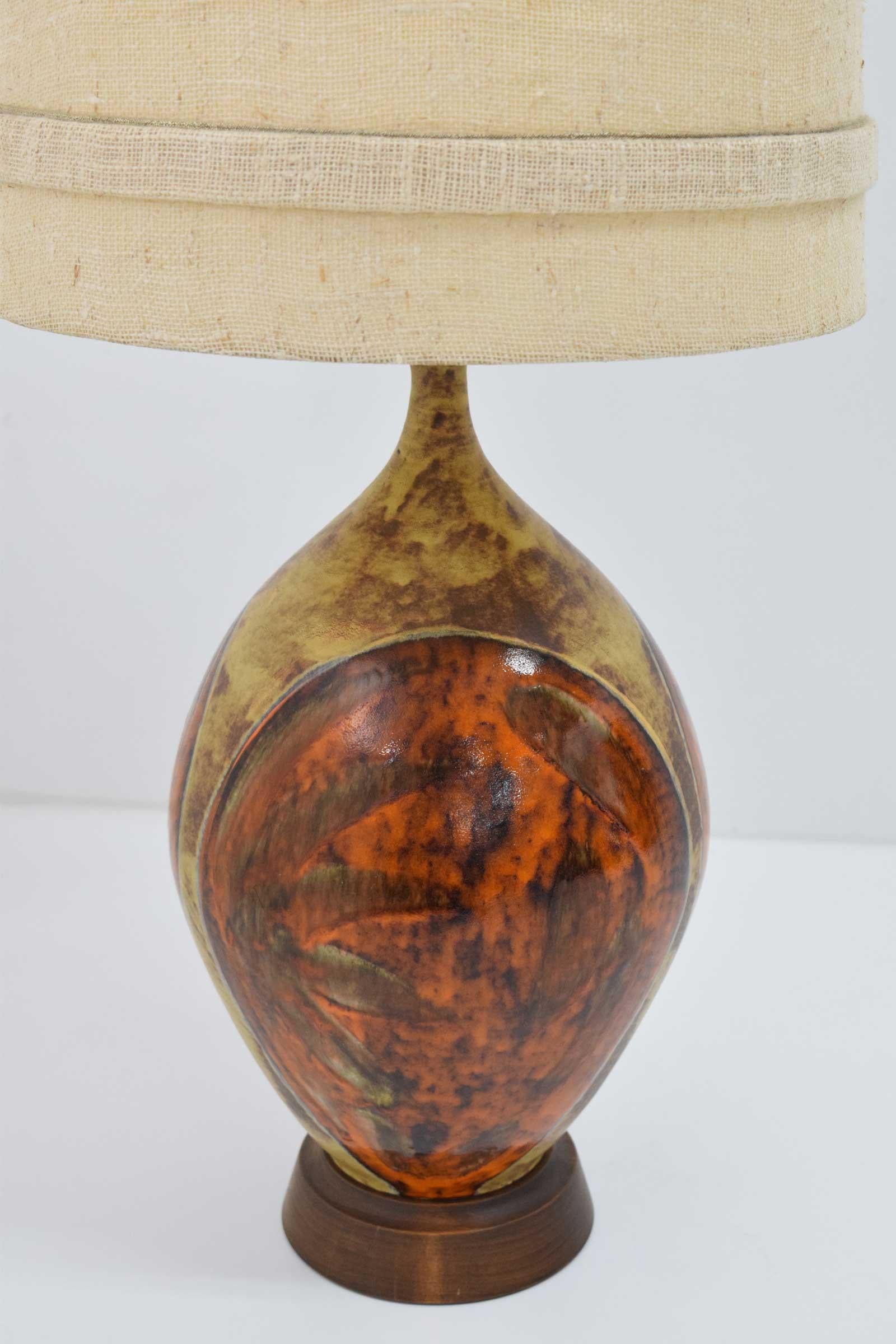 Super nice looking vintage midcentury table lamps. Nice design in orange and brown glazed ceramic. Measurement is to top of harp and diameter is shade diameter.