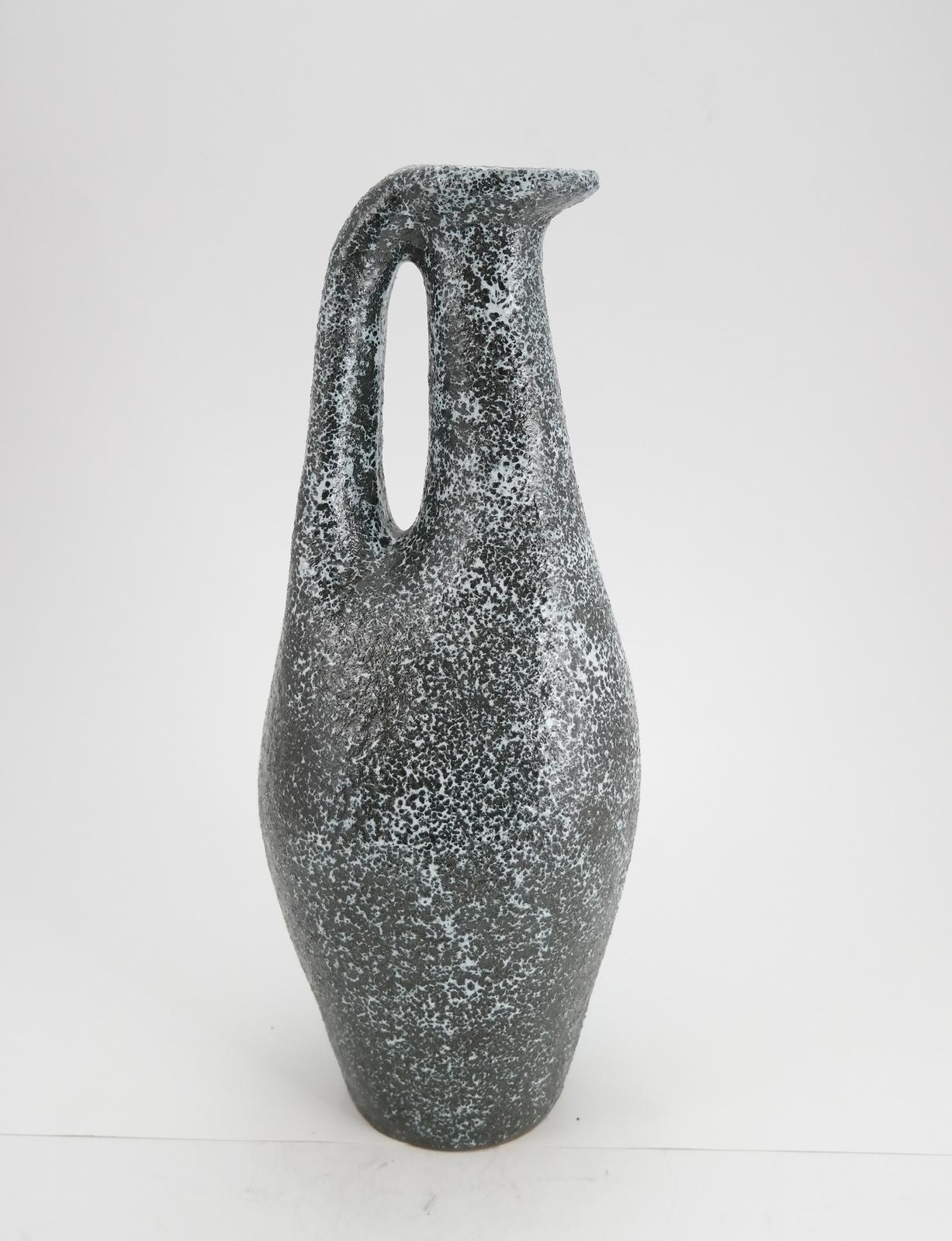 Orange and grey, this Mid-Century Modern ceramic vase was made 1970s.