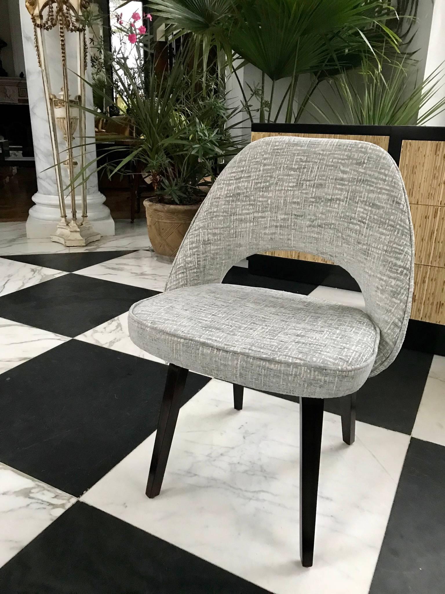 Exquisite set of four Mid-Century Modern dining chairs with rosewood legs by Eero Saarinen for Knoll, circa 1960 made in the US.