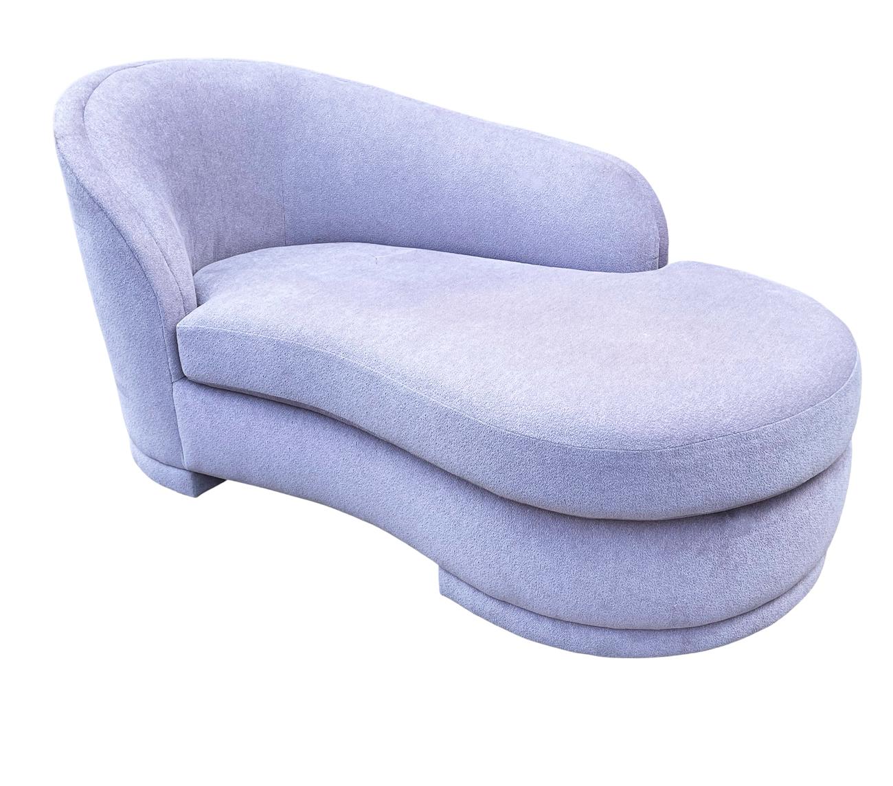 A stunning and beautifully designed chaise lounge produced by Weiman in the 1980's. It features the original purple fabric which possibly could use updating, but is usable as is. Manufacturer label.