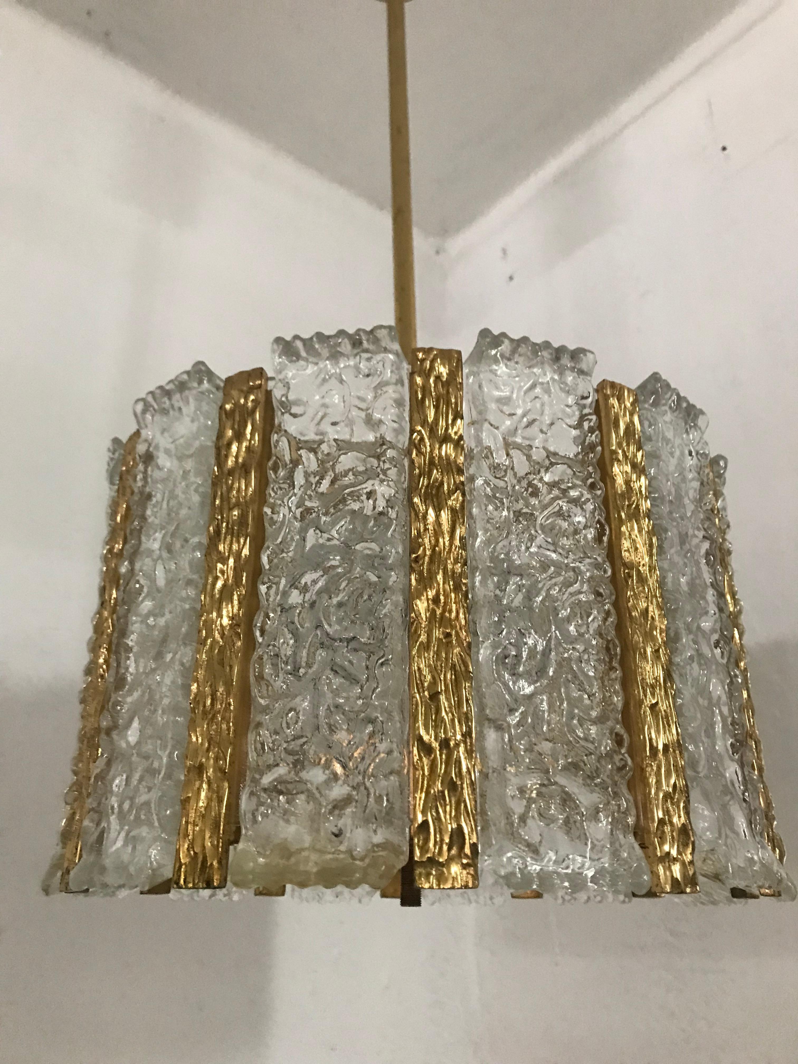 Mid-Century Modern four-light pendant light in frosted glass and gilt brass by J.T. Kalmar, Austria, circa 1960s.

Presents some minor fading in the gilt areas when inspected closely.
 