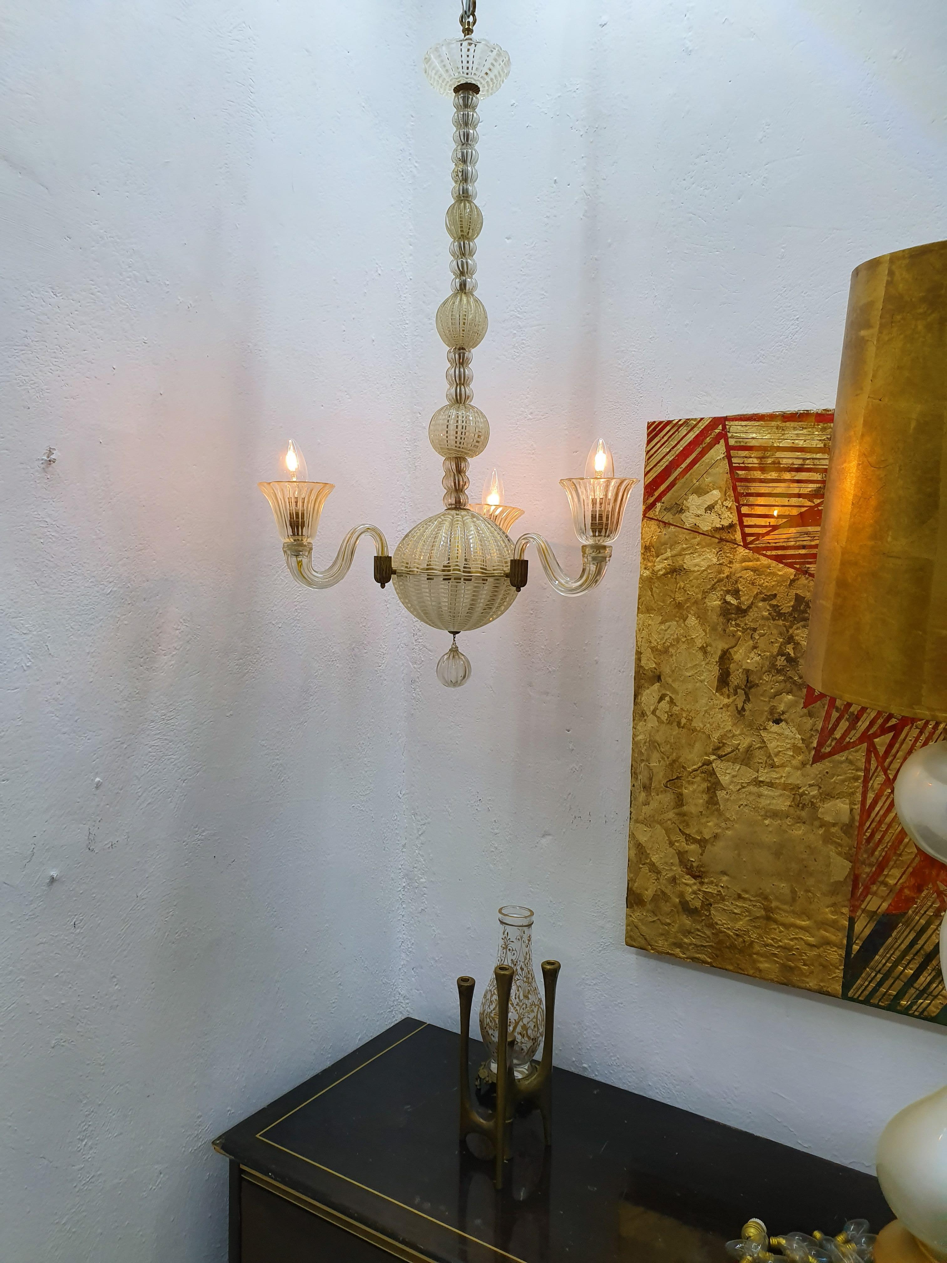 Beautiful Mid-Century Modern 3 light chandelier in hand blown gold, white and clear Murano glass and brass, attributed to Seguso vetro di Arte, circa 1940s.