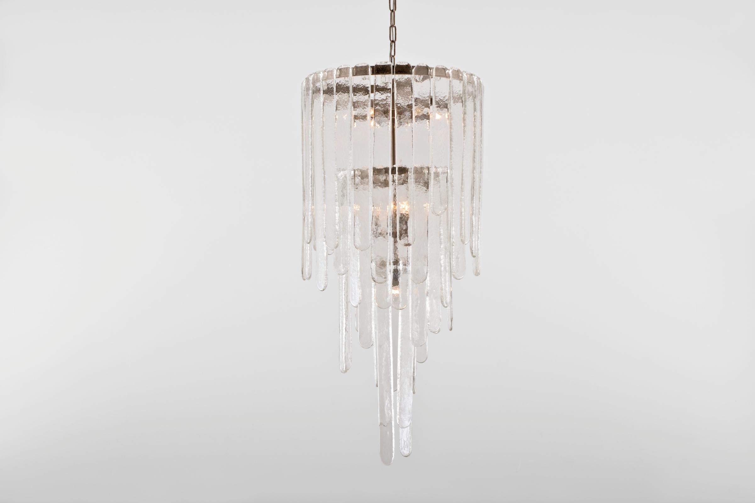Impressive beautiful composed Murano glass chandelier by Carlo Nason for Mazzega, Italy 1969. The chandelier contains 58 clear artistic glass pieces with a nice structure. The glass pieces comes in 3 lengths: 21 large, 21 middle and 16 smaller