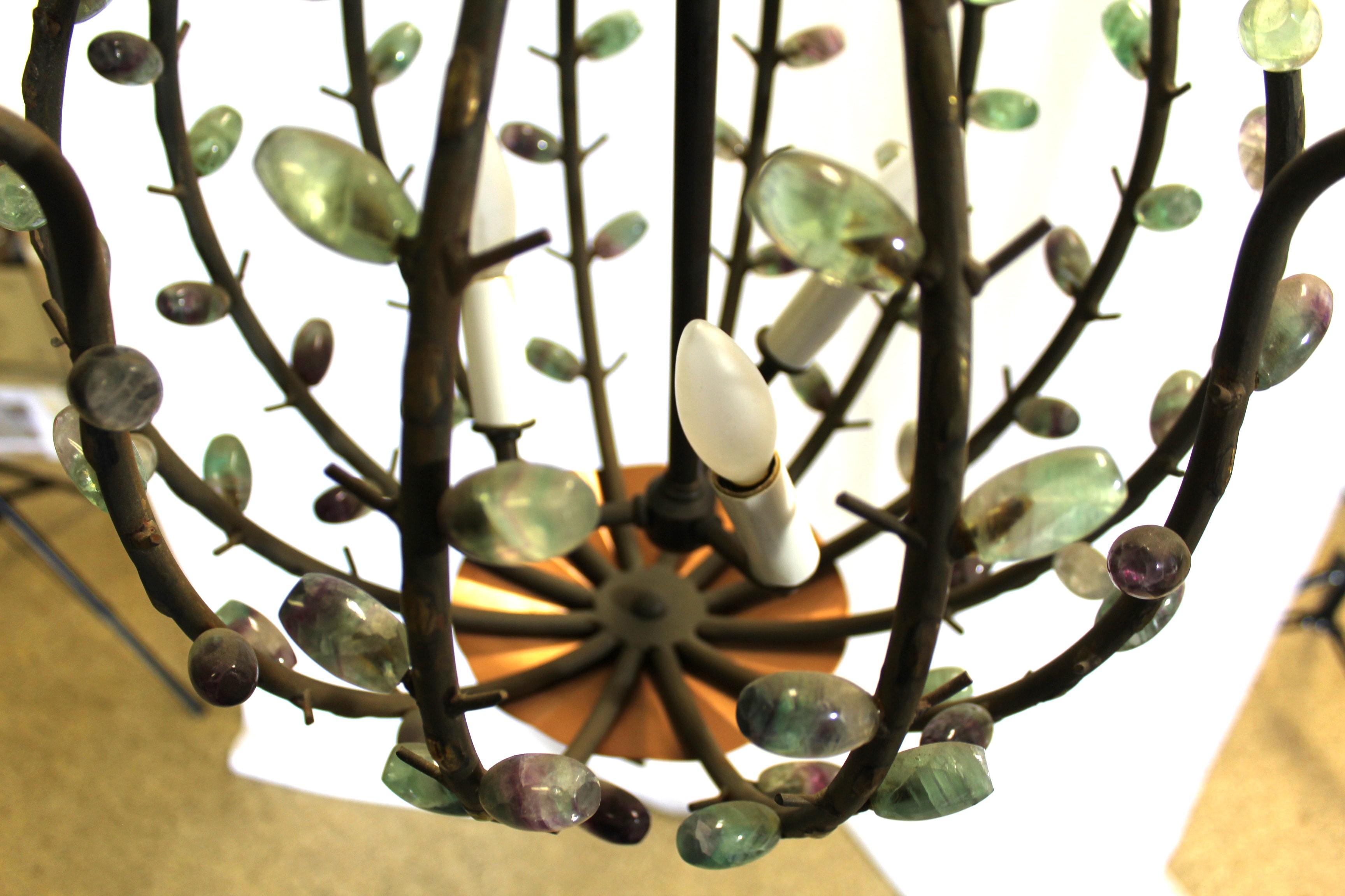 A hard to find special Designed Chandelier by the Artist (Andre Dubreuil ) made after his style for an Interior Designer in Los Angeles .  The main frame is forged steel and has applied brass decorations polished .  The applied semi-precious