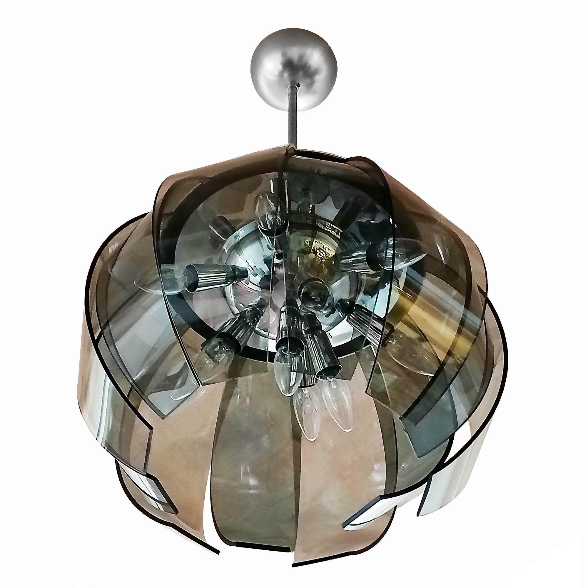 Chandelier-lantern with 12 curved glass plates in pale green and white-smoky gray colour; central axis, upper plate and electrical mounting system in nickel-plated metal (10 bulbs). Very high quality.

Italy c.1950-60.