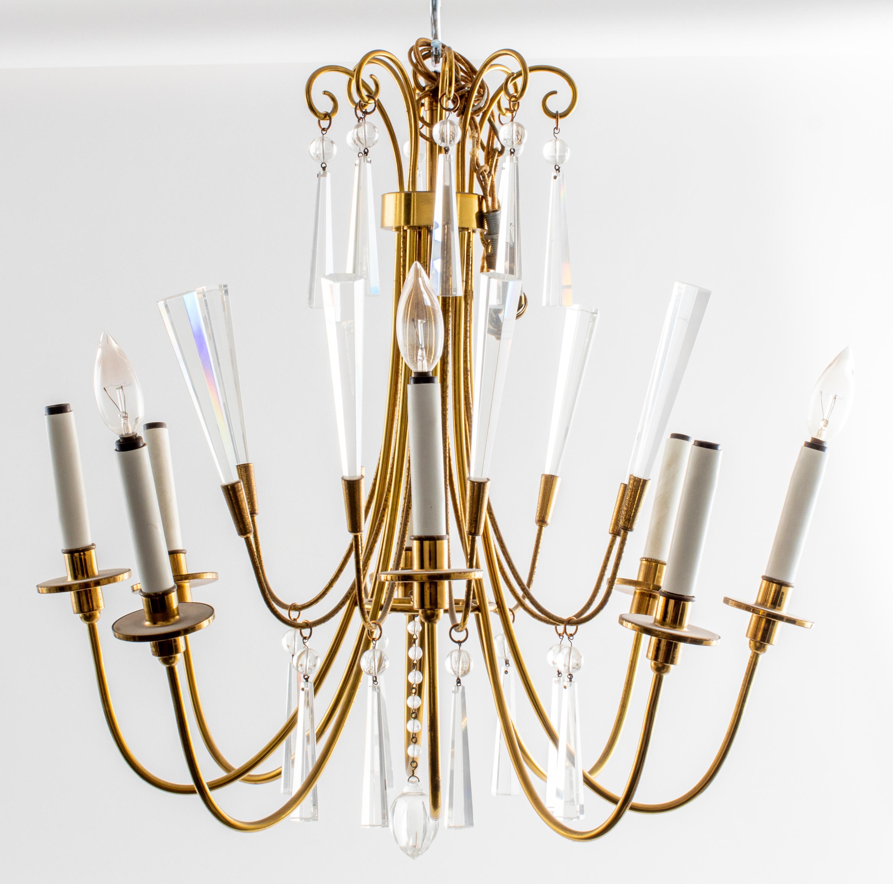 Mid-Century Modern European brass chandelier with crystal pendants and central pendant ball, likely made in Austria. 24