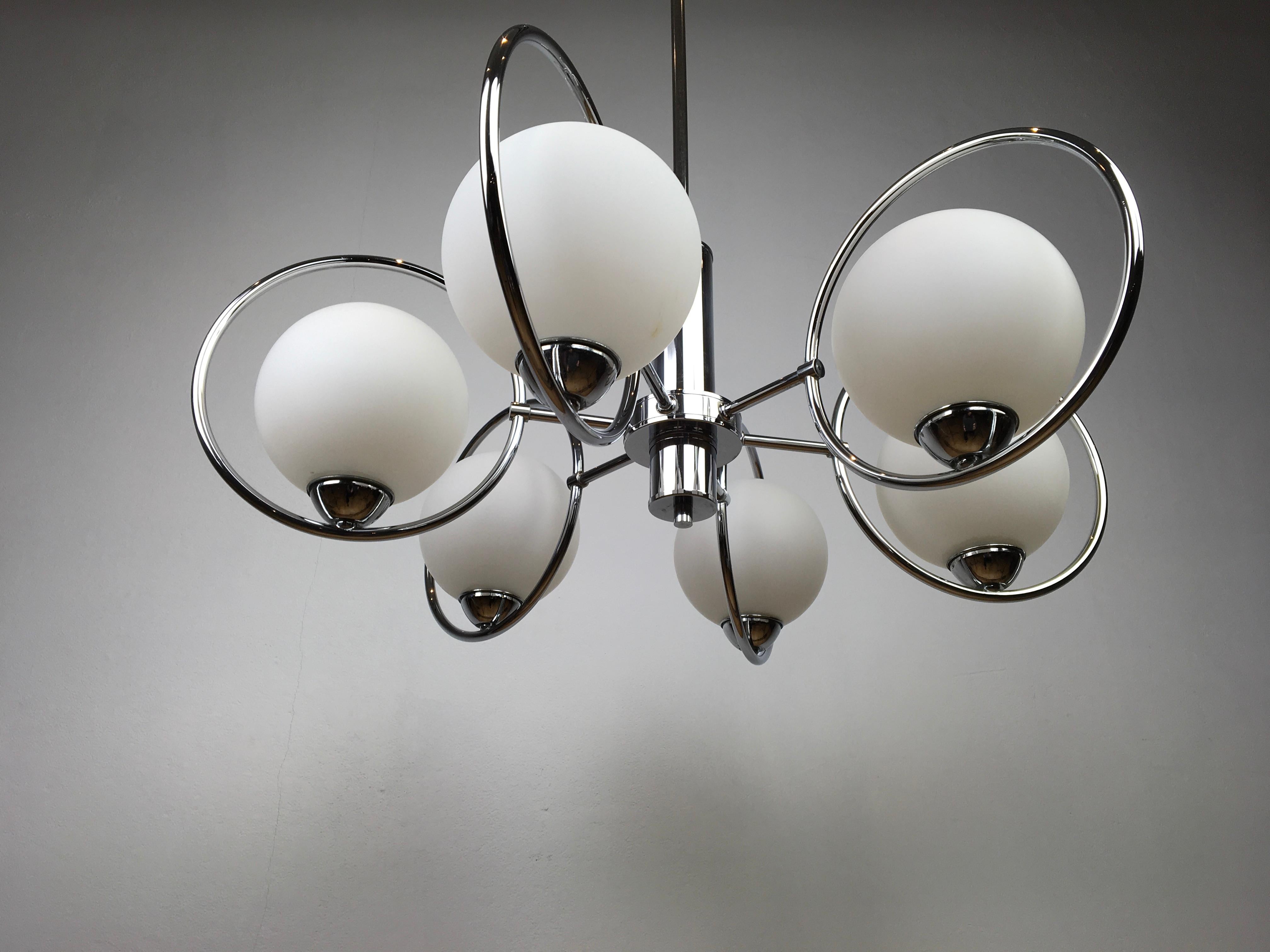 Modern style chandelier from the 1970s with chrome ring and opaline glass shades.
This 6-armed chandelier has a beautiful design: Modern style, atomic, Sputnik.
The chrome of this lamp is still in beautiful shiny condition.

  