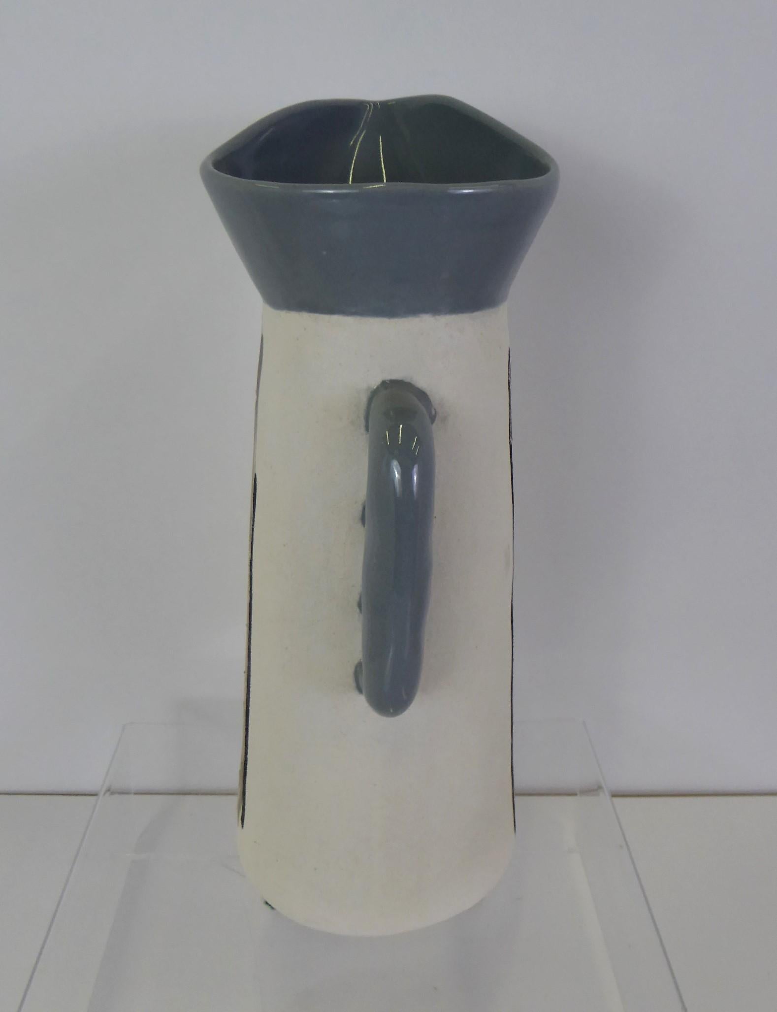 Fabulous modern tall sculptural pitcher by Charles and Alice Smith for their company Chalice of California, 1950s. In 1945 they established their studio in Los Angeles and named it CH(arles)ALICE, a combination of their names. They produced artistic