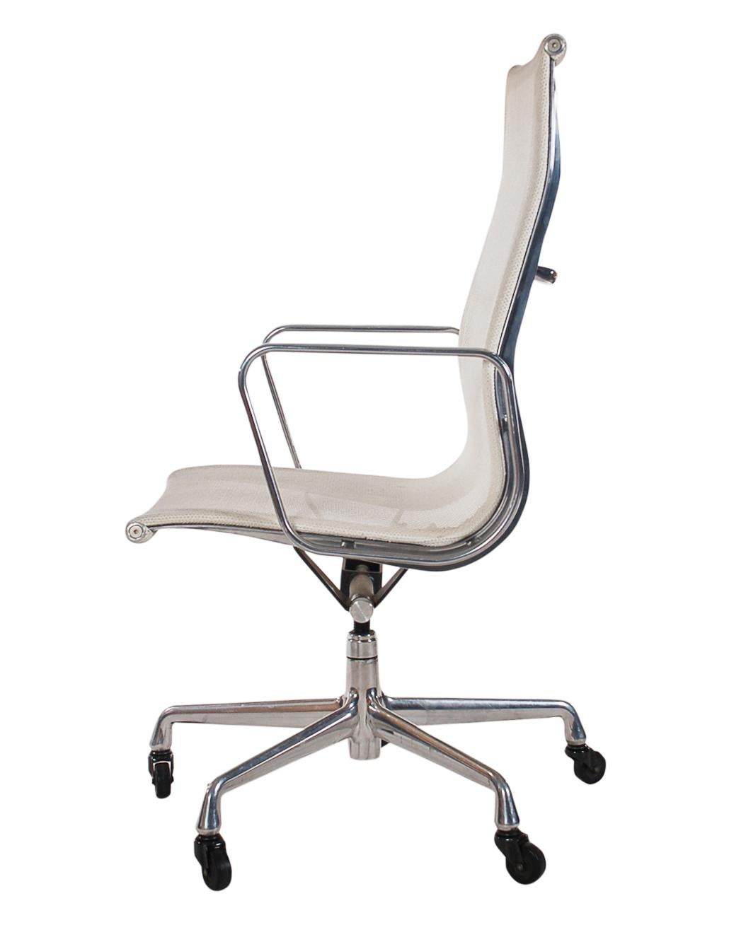 A Classic design by Charles Eames and produced by Herman Miller. This chair features an adjustable aluminum frame, casters for easy tasking, and a white mesh sling seating area. Extremely comfortable. 