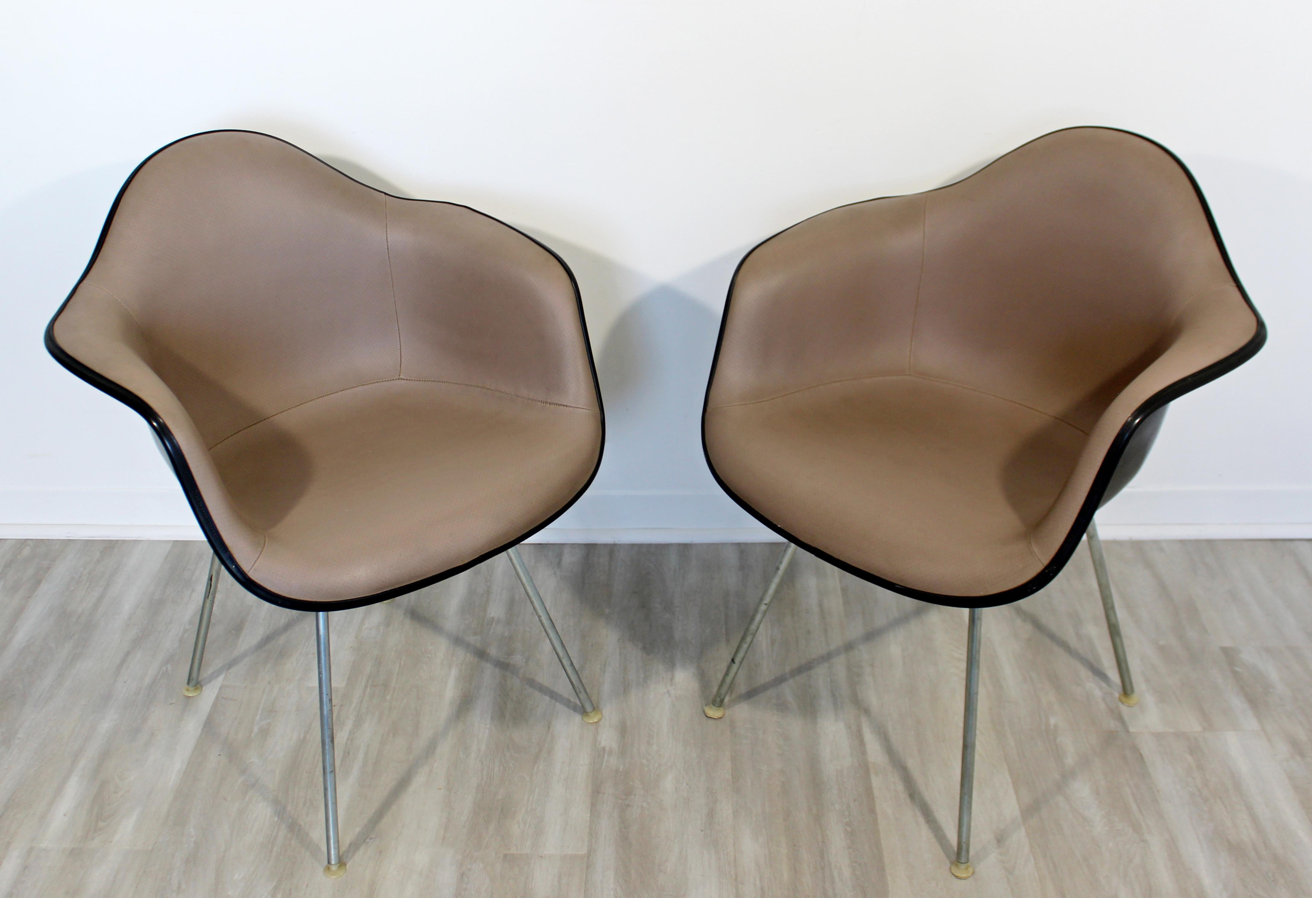 For your consideration is a wonderful pair of shell armchairs, with fabric seats, by Charles Eames for Herman Miller, circa 1960s. In excellent vintage condition. The dimensions are 25